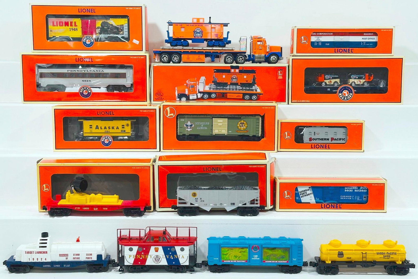 Lionel Modern O Gauge Fifteen (15) Assorted Freight Cars some Boxed: Lionel Modern O Gauge Fifteen (15) Assorted Freight Cars some Boxed, including Boy Scout Box Car, Alaska 2 Bay Hopper, 1948 Lionel Art Box Car, Pennsylvania Coach Car, TMT - 18405 Flatbed Toy Truck wi