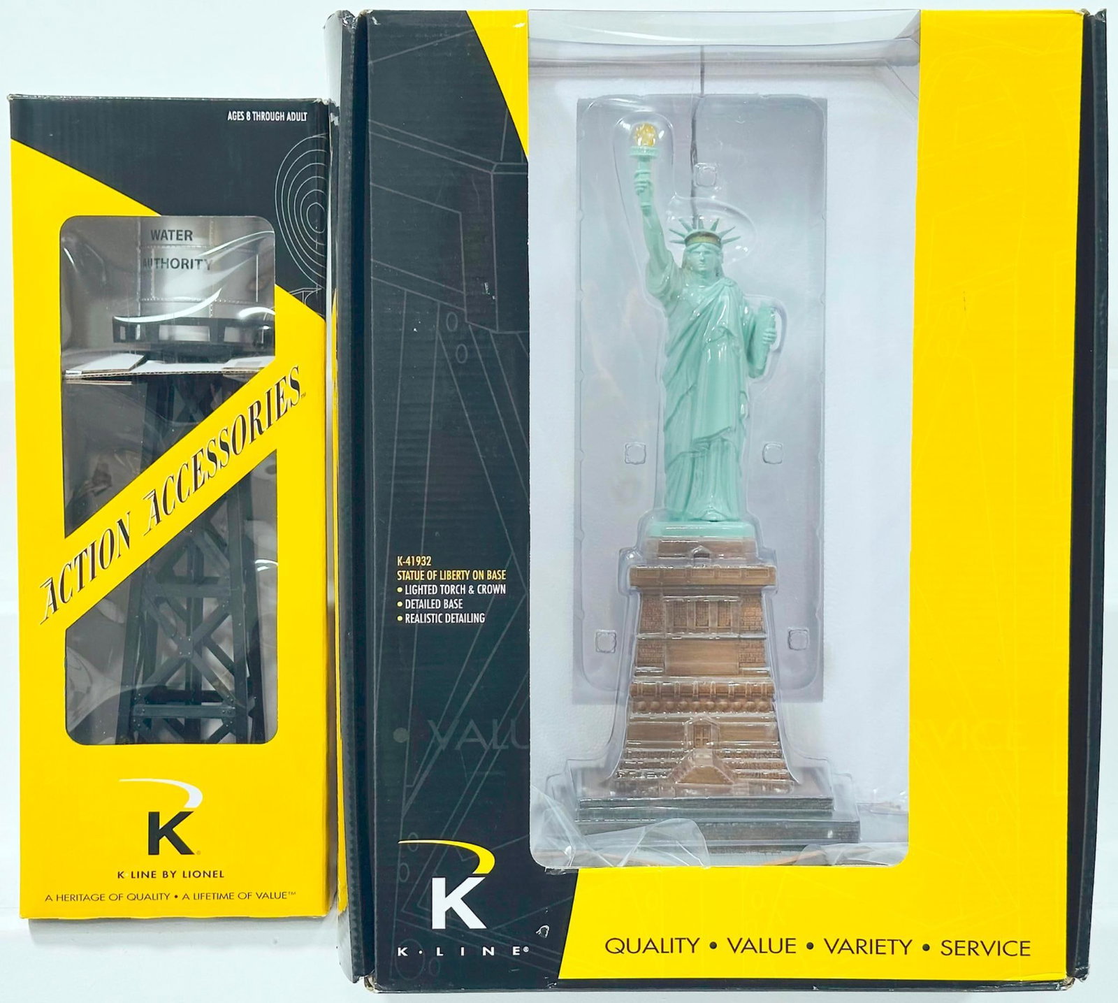K-Line Modern O Gauge Statue of Liberty on the base and Water Tower with light Boxed: K-Line Modern O Gauge Statue of Liberty on the base and Water Tower with light Boxed, each in C9 and each with its original box.