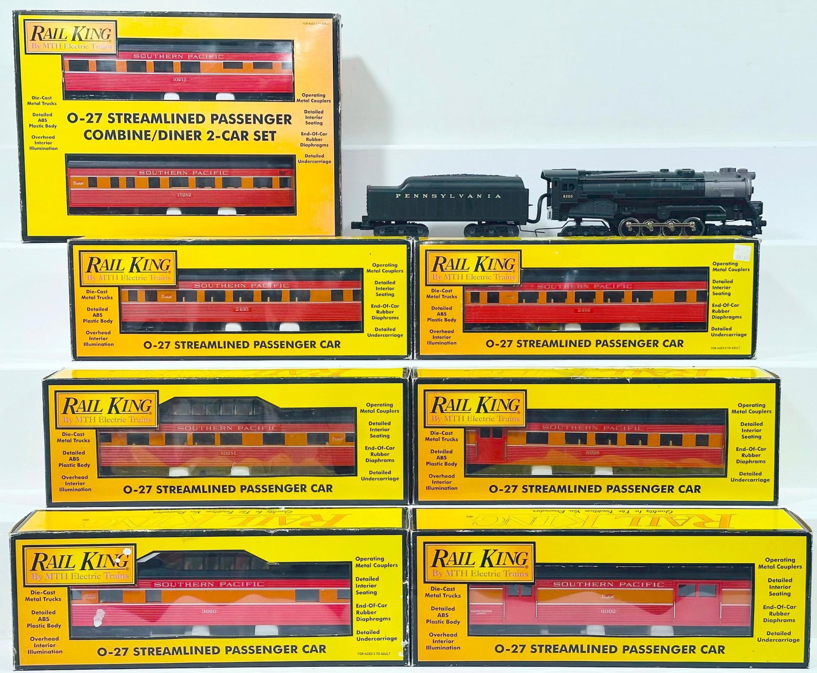 MTH Modern O Gauge 4 - 8 - 4 Pennsylvania Locomotive and Tender and Eight (8) Assorted Southern: MTH Modern O Gauge 4 - 8 - 4 Pennsylvania Locomotive and Tender and Eight (8) Assorted Southern Pacific Passenger Cars Boxed, with the Pennsylvania Locomotive and Tender, each in C7 plus or better. Th