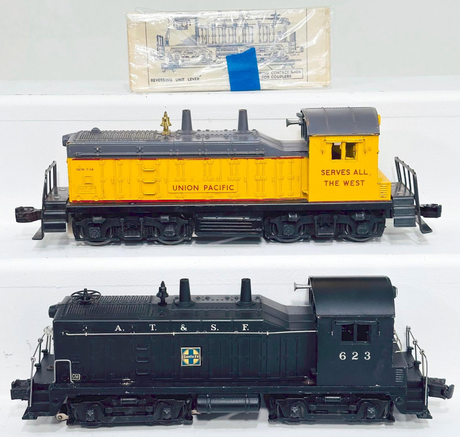 Lionel Postwar O Gauge 613 Union Pacific Switcher and 623 ATSF Switcher: Lionel Postwar O Gauge 613 Union Pacific Switcher and 623 ATSF Switcher, with the 613 in C6 plus and the 623 in C7.