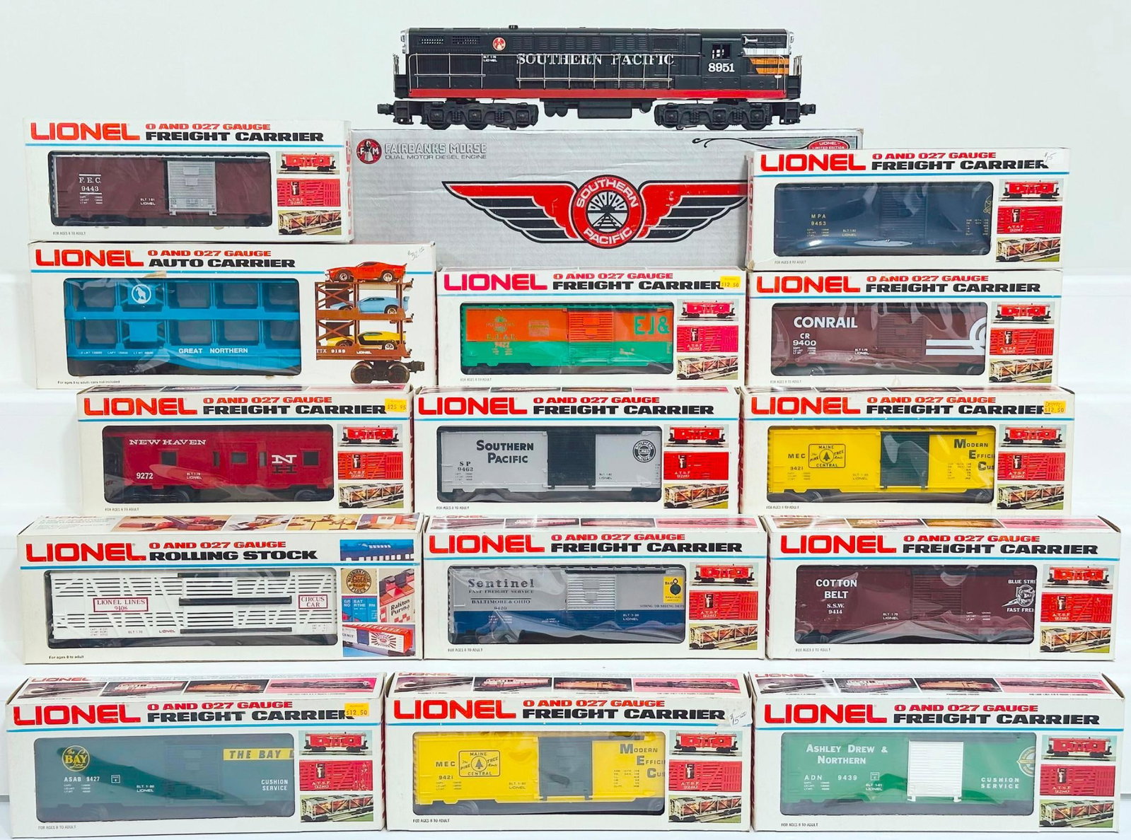 Lionel Modern O Gauge Southern Pacific Fairbanks Morse FM Trainmaster and Fourteen (14) Assorted: Lionel Modern O Gauge Southern Pacific Fairbanks Morse FM Trainmaster and Fourteen (14) Assorted Freight Cars Boxed, including the Southern Pacific Trainmaster, Bayline Box Car, Maine Central Box Car,