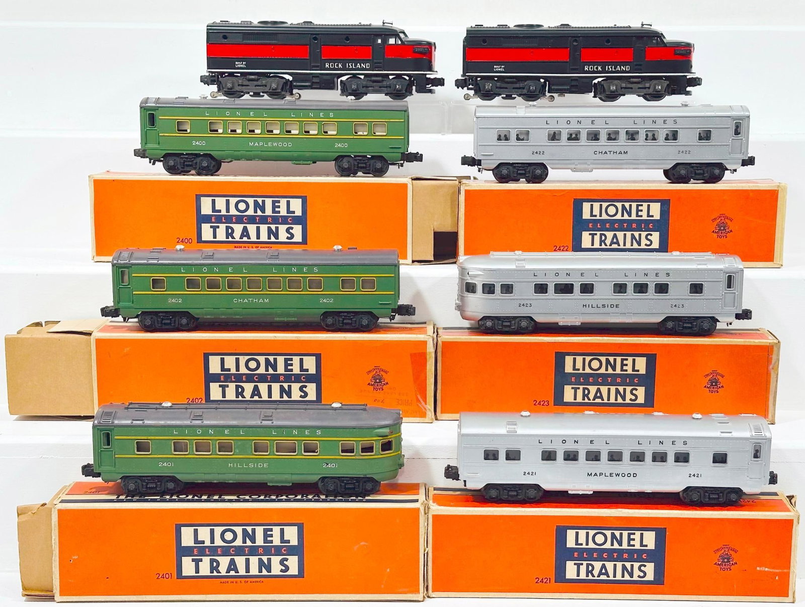Lionel Postwar O Gauge 2031 Rock Island A - A Alco Diesel Units and Six (6) Assorted Passenger Cars: Lionel Postwar O Gauge 2031 Rock Island A - A Alco Diesel Units and Six (6) Assorted Passenger Cars, with the 2031 A - A Alco Diesel Units, each in C7 or better. This Lot also includes 2401, 2421, 242