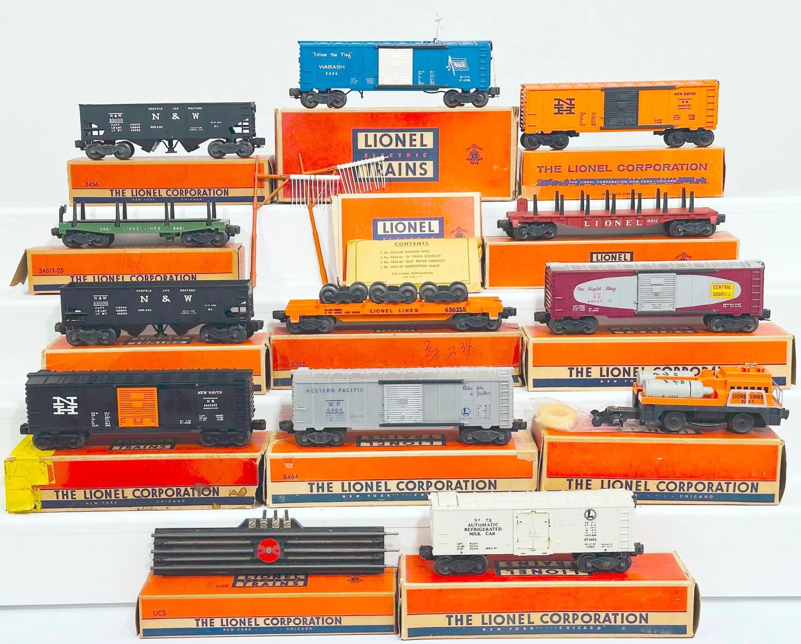 Lionel Postwar O Gauge Eleven (11) Assorted Freight Cars and 3927 Track Cleaning Car: Lionel Postwar O Gauge Eleven (11) Assorted Freight Cars and 3927 Track Cleaning Car, each in C7 or better and each with its original box, although some the original boxes have end flap damage or miss