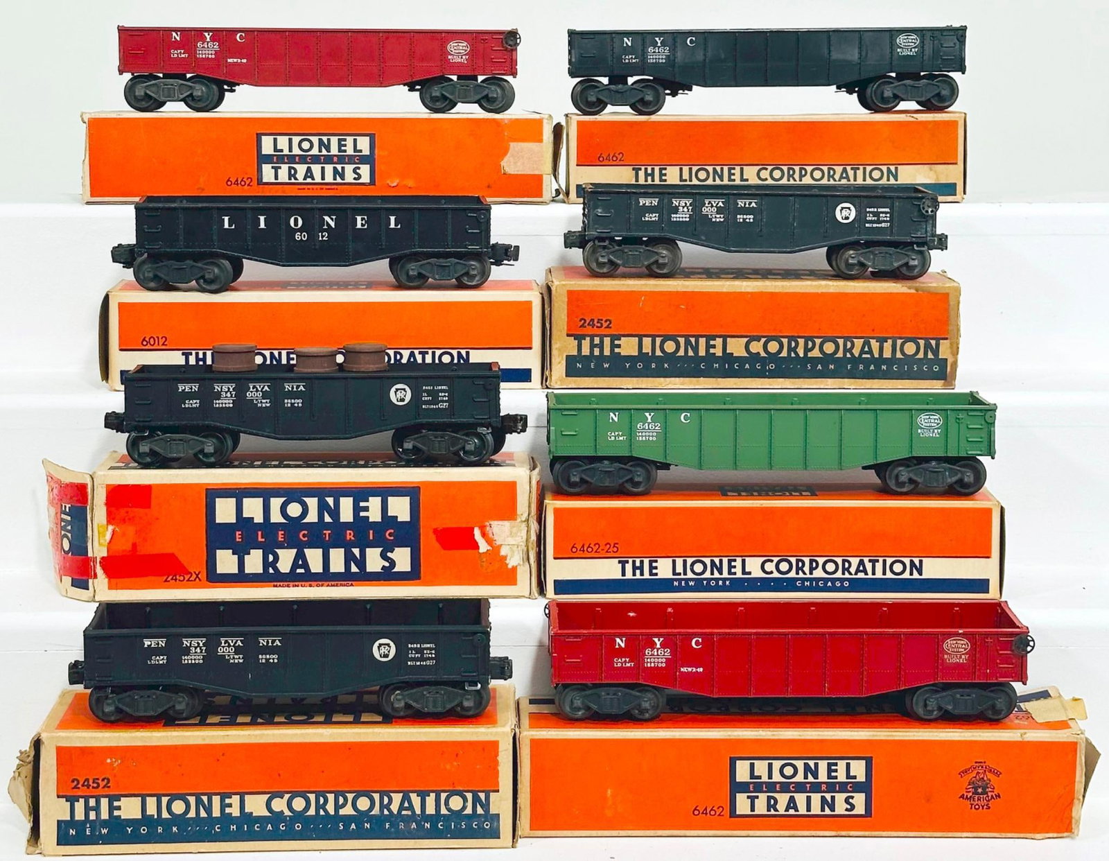 Lionel Postwar O Gauge Eight (8) Assorted Gondola Cars: Lionel Postwar O Gauge Eight (8) Assorted Gondola Cars, each in C7 or better and each with its original box, with most original boxes having missing end flaps or end flap damage.