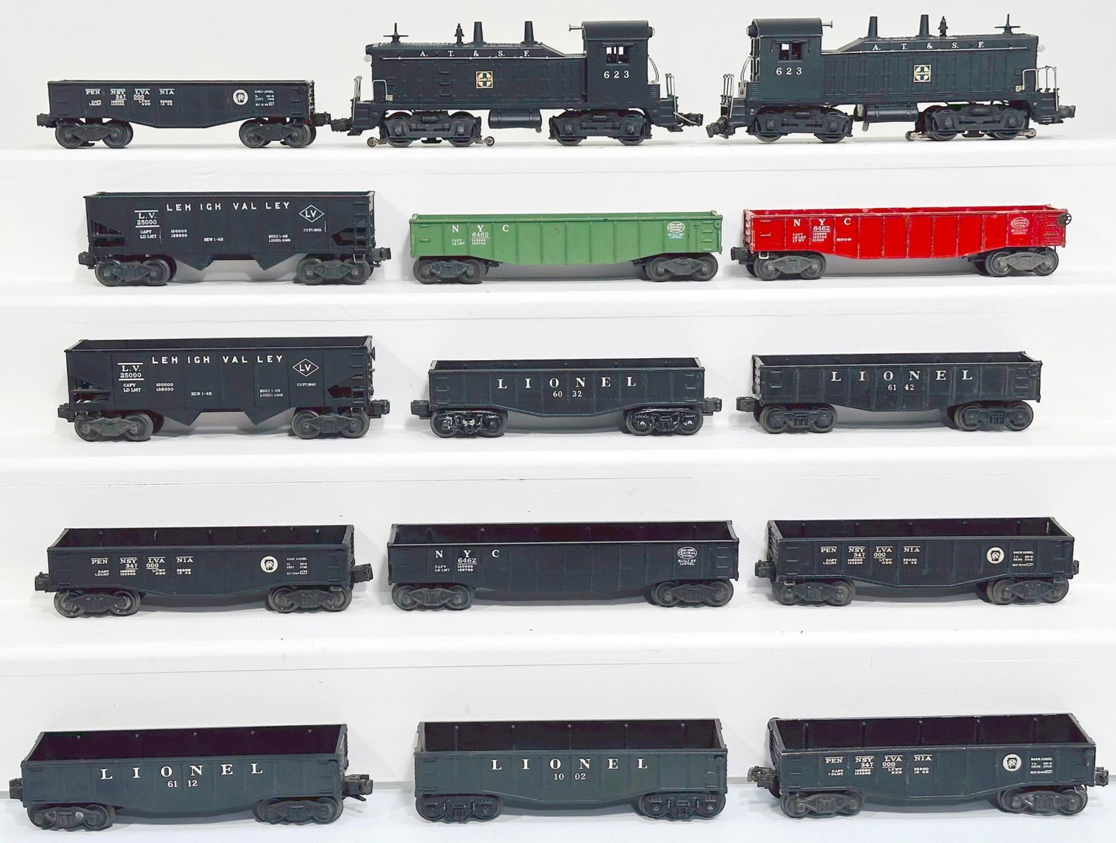 Lionel Postwar O Gauge 623 ATSF Switcher X2 and Thirteen (13) Assorted Gondolas and Hopper Cars: Lionel Postwar O Gauge 623 ATSF Switcher X2 and Thirteen (13) Assorted Gondolas and Hopper Cars, with the 623 in C7 and the other 623 in C7. The Thirteen (13) Assorted Hopper and Gondola Cars, each in