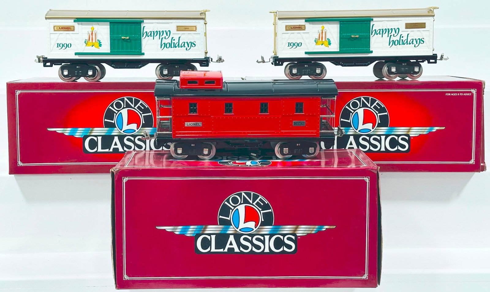 Lionel Modern Classics Standard Gauge 190 Christmas Car - 1517 Caboose - 1990 Christmas Car Boxed: Lionel Modern Classics Standard Gauge 190 Christmas Car - 1517 Caboose - 1990 Christmas Car Boxed, each in C9 and each with its original box.