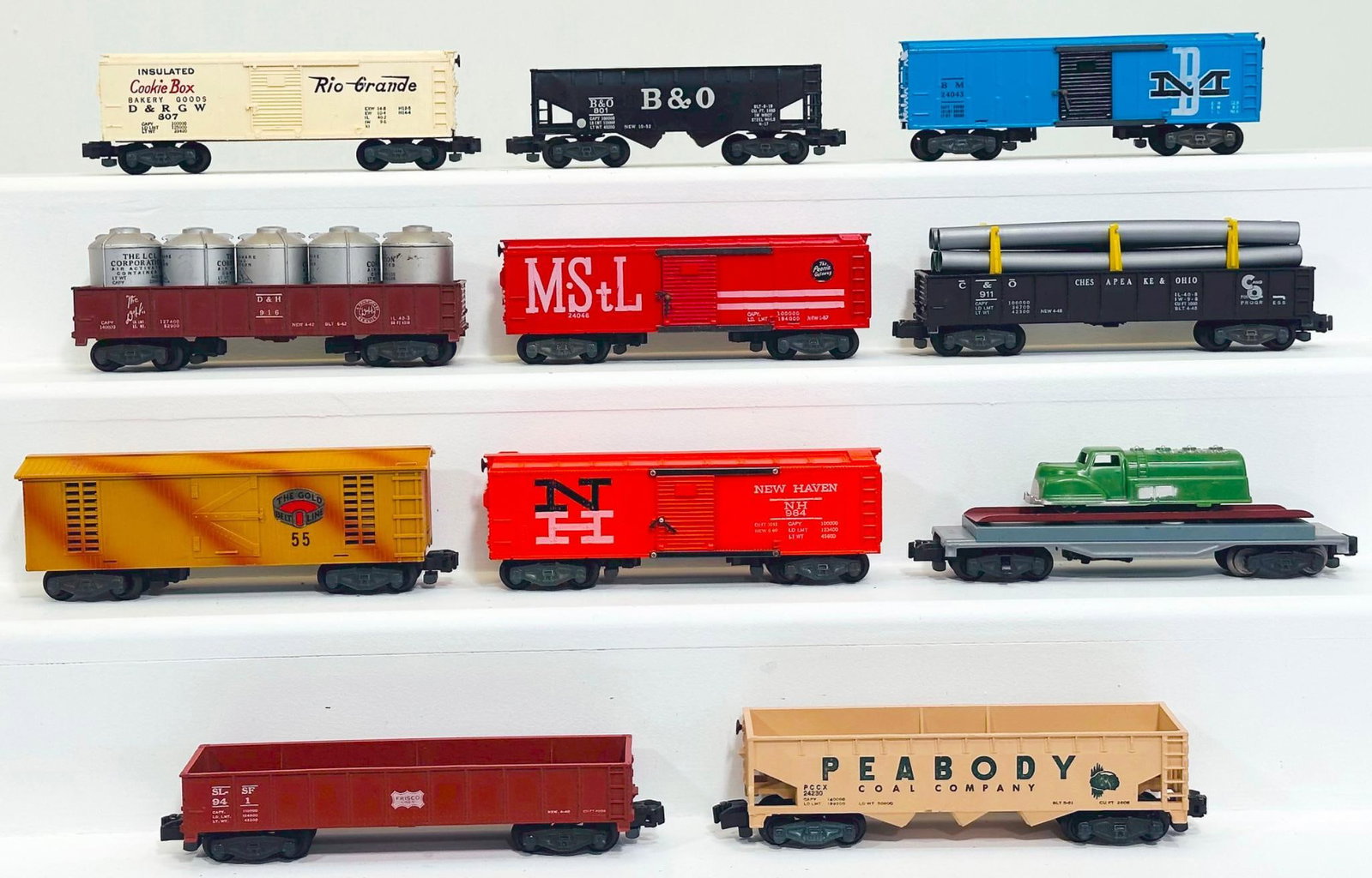 American Flyer Postwar S Gauge Eleven (11) Assorted Freight Cars: American Flyer Postwar S Gauge Eleven (11) Assorted Freight Cars, including 984 in C7 plus, 55 in C7 plus, 24230 in C7, 941 in C7 plus, 915 with green gasoline truck load in C7, 24048 in C7 - rust on 