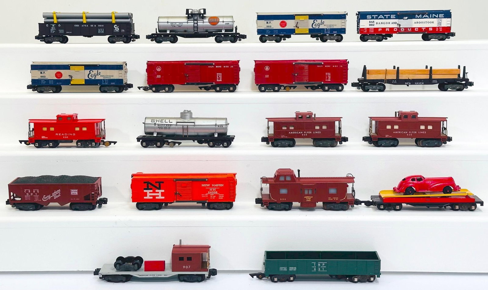 American Flyer Postwar S Gauge Eighteen (18) Assorted Freight Cars: American Flyer Postwar S Gauge Eighteen (18) Assorted Freight Cars, including 24309 in C7, 928 with lumber load in C7 plus, 930 in C7 plus, 930 in C7 plus, 921 in C7 plus, 630 painted Caboose in C7 pl