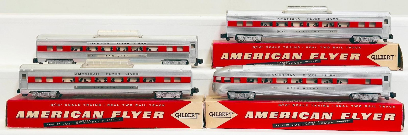 American Flyer Postwar S Gauge 962 - 962 - 962 - 963 Aluminum Passenger Cars with red stripe through: American Flyer Postwar S Gauge 962 - 962 - 962 - 963 Aluminum Passenger Cars with red stripe through windows, each in C7 plus or better and with original boxes numbered 24812, 24812 and 24832.