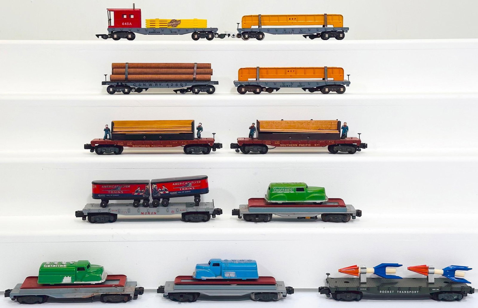 American Flyer Postwar S Gauge Eleven (11) Assorted Freight Cars: American Flyer Postwar S Gauge Eleven (11) Assorted Freight Cars, including 6458 Chicago Northwestern Caboose in C7, 627 C & NWRY Flat Car with girder load in C7, 627 C & NWRY Flat Car were girder loa
