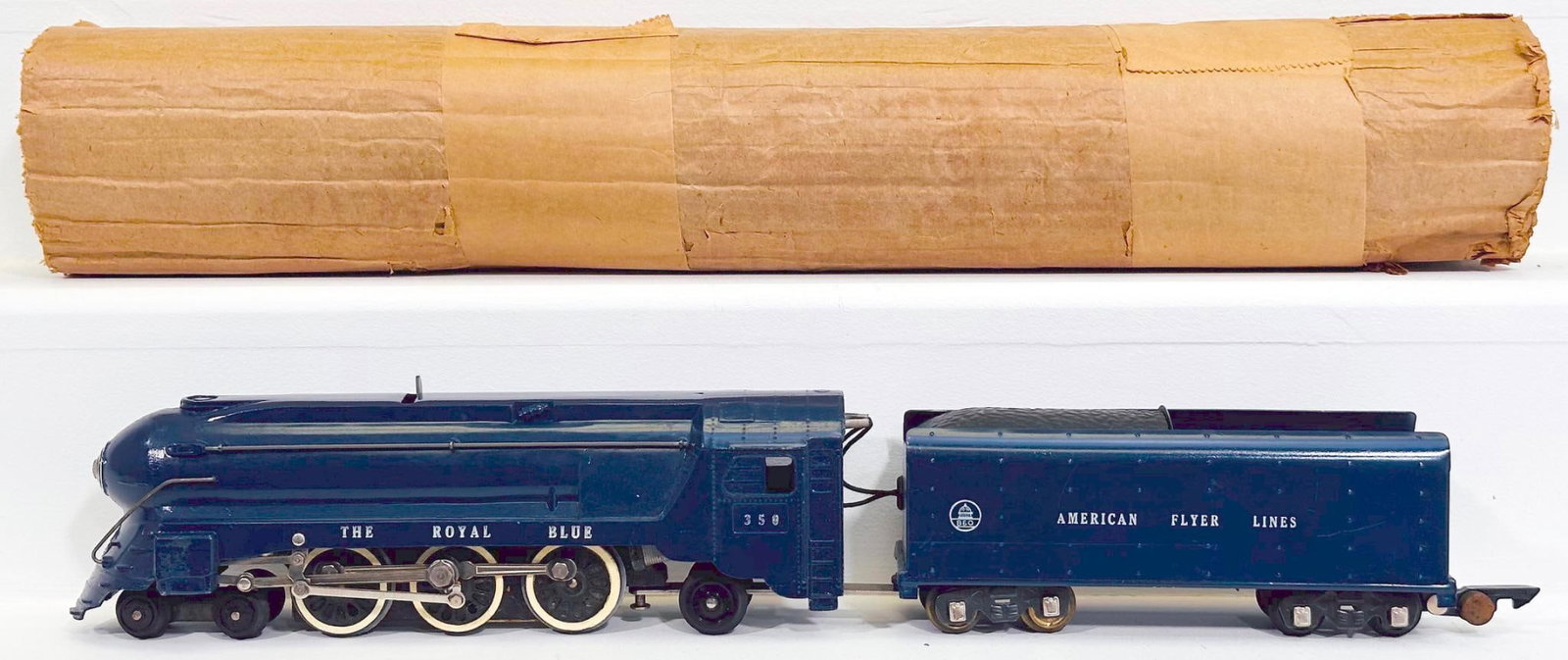 American Flyer Postwar S Gauge 350 The Royal Blue 4 - 6 - 2 Locomotive and Tender: American Flyer Postwar S Gauge 350 The Royal Blue 4 - 6 - 2 Locomotive and Tender, in C7 plus, and with its original tag â€œdo not attempt to revolve wheelsâ€? and with its original wrap.