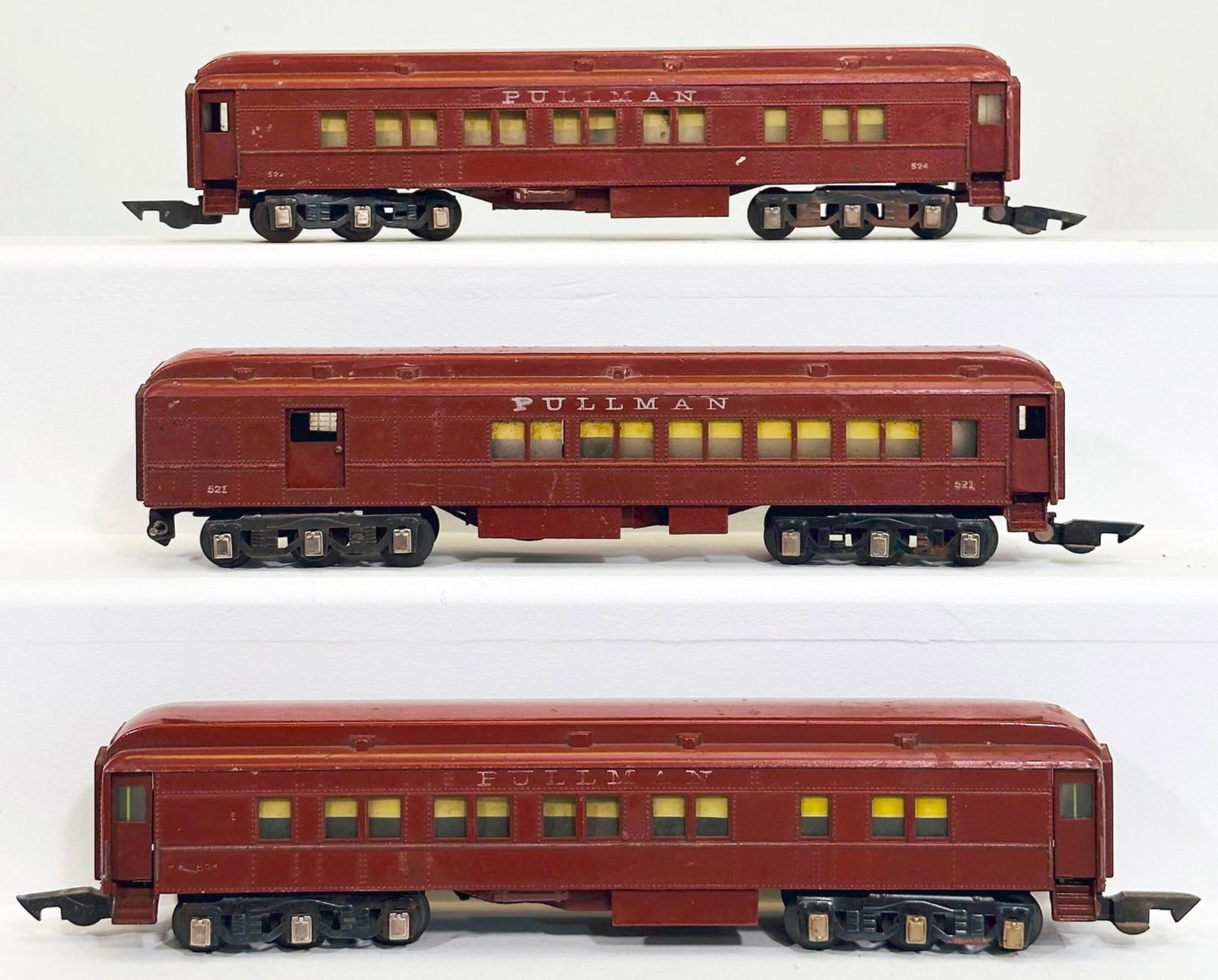 American Flyer Postwar O Gauge 521 - 523 - 524 6 Wheel Heavyweight Passenger Cars: American Flyer Postwar O Gauge 521 - 523 - 524 6 Wheel Heavyweight Passenger Cars, each in C6 plus to C7 minus. Each of the numbers on each of the Passenger Cars is fading.