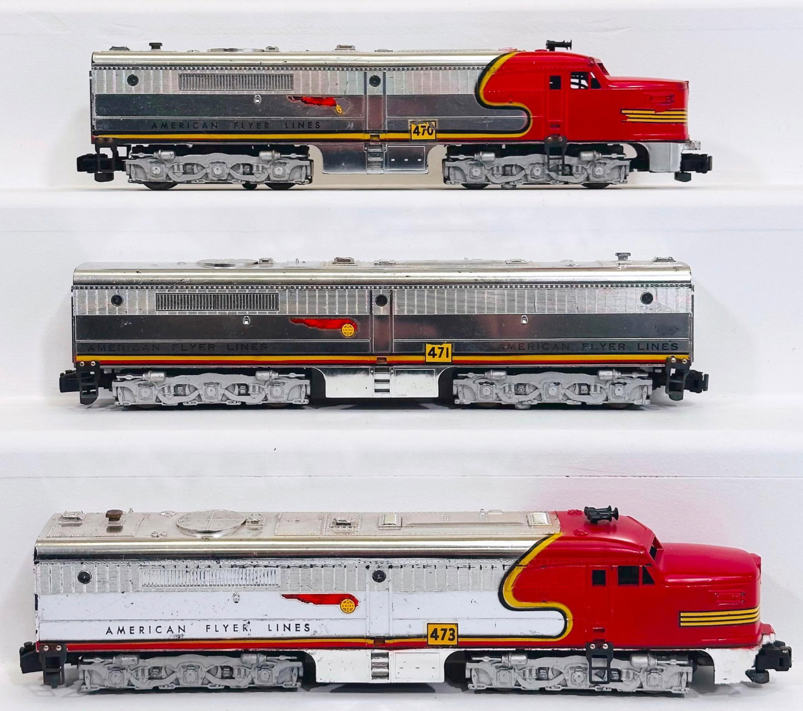 American Flyer Postwar S Gauge 470 - 471 - 473 Santa Fe red and chrome A - B - A Alco Diesel Units: American Flyer Postwar S Gauge 470 - 471 - 473 Santa Fe red and chrome A - B - A Alco Diesel Units, with the 470 in C7 minus because of small decal loss, the 471 in C7 and the 473 in C7 minus because 