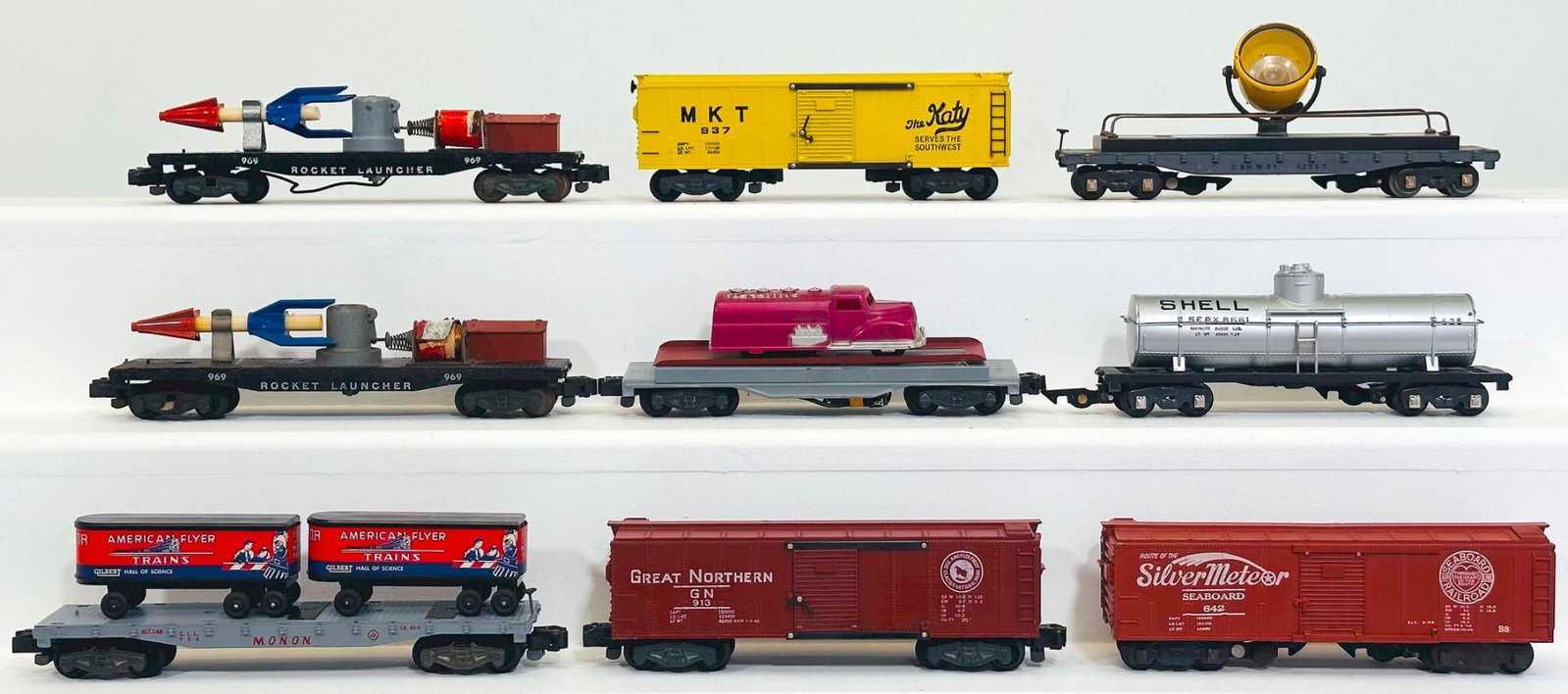 American Flyer Postwar S Gauge Nine (9) Assorted Freight Cars: American Flyer Postwar S Gauge Nine (9) Assorted Freight Cars, including 969 in C7, 625 in C7 minus, 634 in C7, 983 in C7 plus, 642 in C7 plus, 956 in C7 plus, 915 with dark red gasoline truck load in