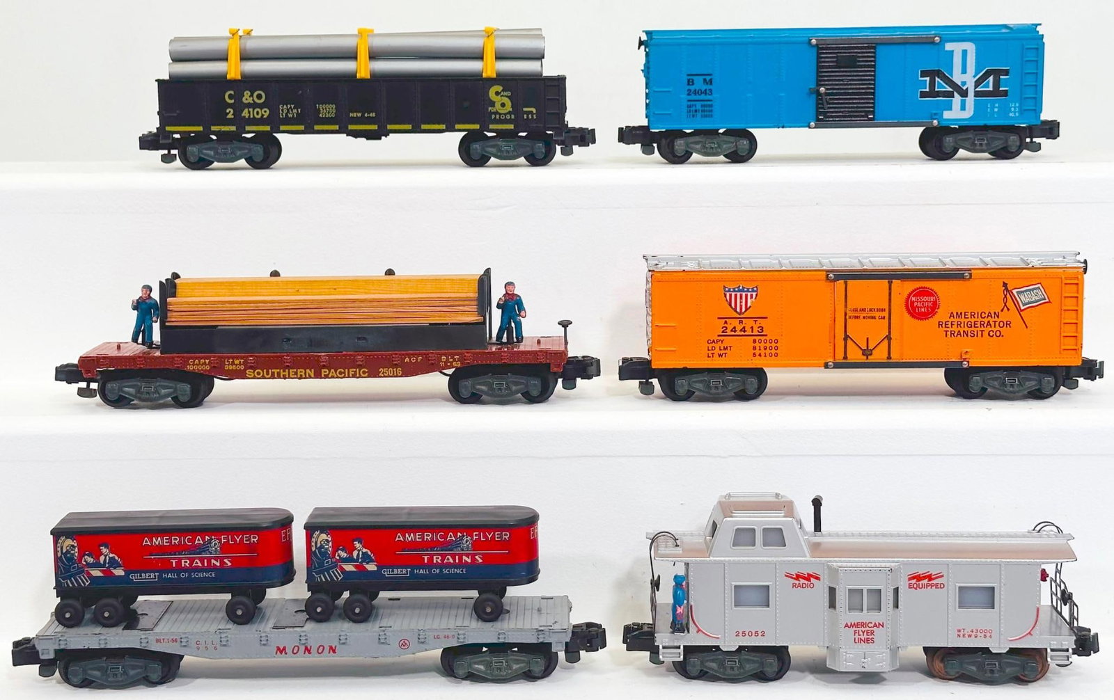 American Flyer Postwar S Gauge Six (6) Assorted Freight Cars: American Flyer Postwar S Gauge Six (6) Assorted Freight Cars, including 24043 in C7 because of small rust on door guides, 24413 in C7 plus, 956 in C7 plus, 25016 with lumber load in C7 plus, 25052 in 