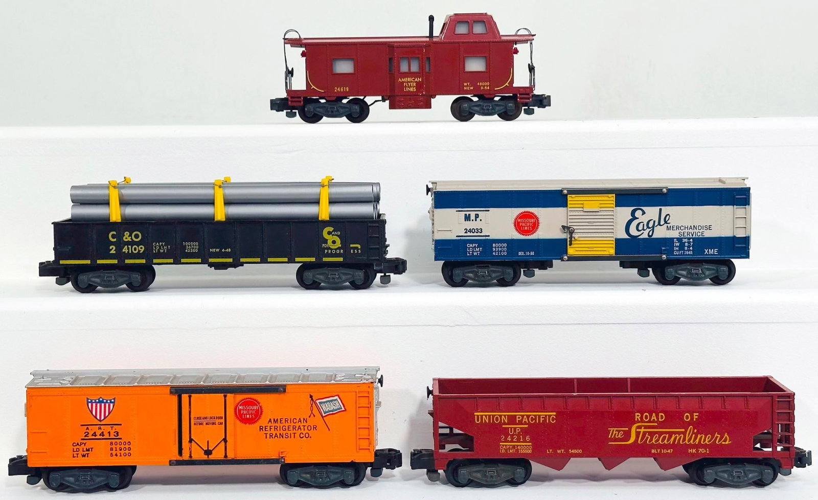 American Flyer Postwar S Gauge Five (5) Assorted Freight Cars: American Flyer Postwar S Gauge Five (5) Assorted Freight Cars, including 24619 in C7 plus, 24216 in C7 plus, 24033 in C7 plus, 24109 with pipe load in C7 plus and 24413 in C7.