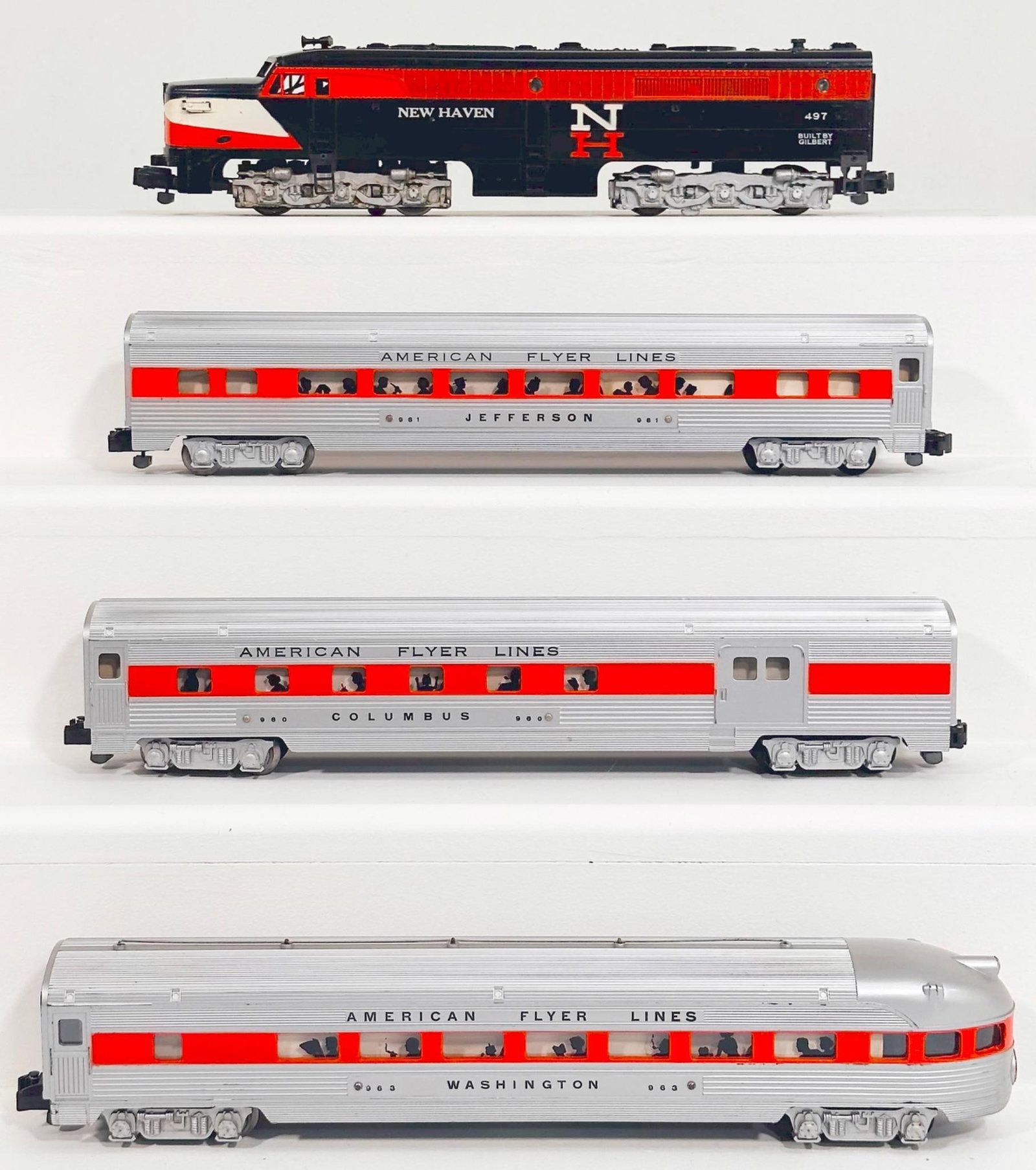 American Flyer Postwar S Gauge 497 New Haven Alco A Powered Diesel Unit and 960 - 961 - 963 orange: American Flyer Postwar S Gauge 497 New Haven Alco A Powered Diesel Unit and 960 - 961 - 963 orange stripe thru Passenger Cars windows, each in C7 plus or better.