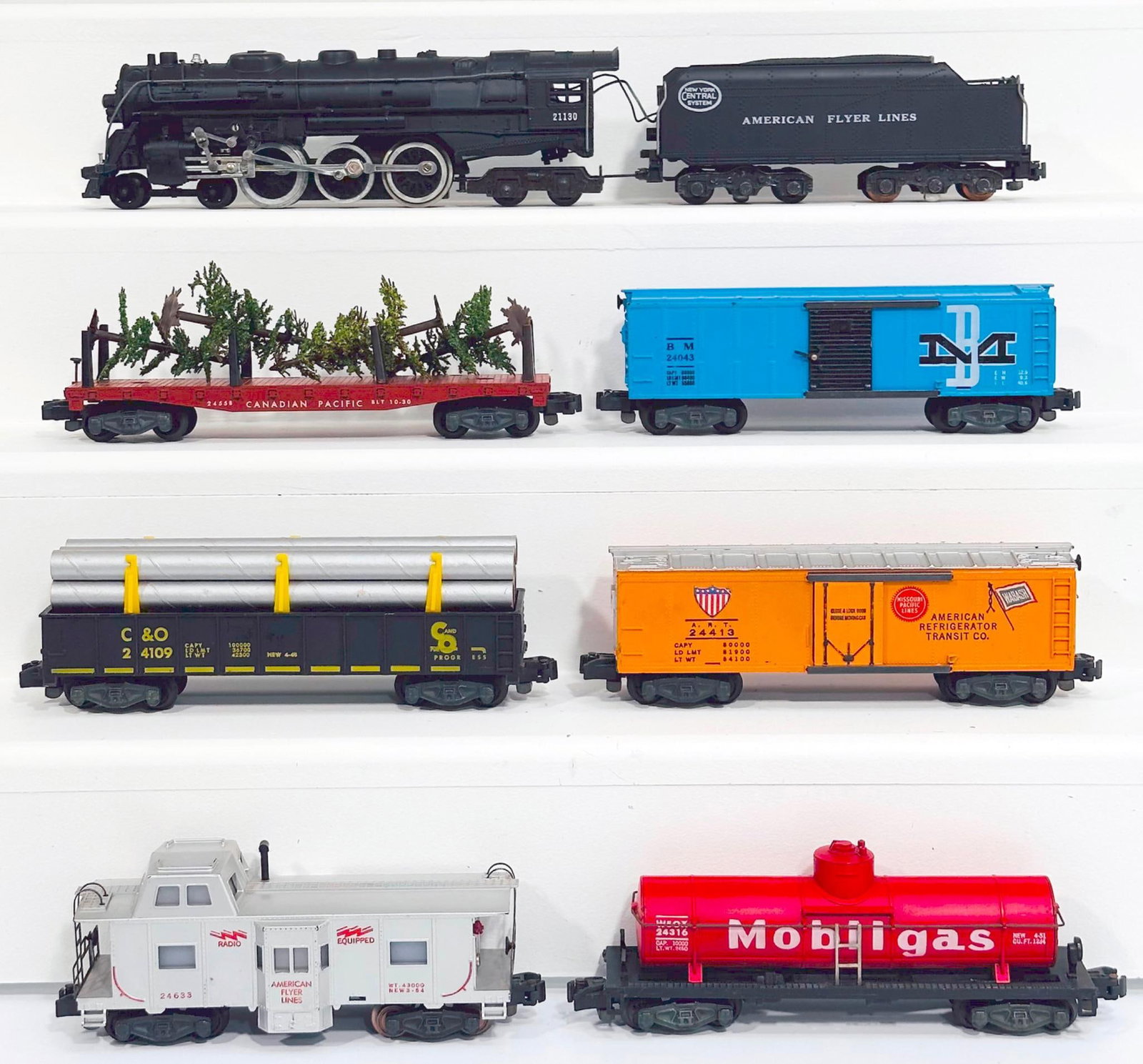 American Flyer Postwar S Gauge 21130 New York Central 4 - 6 - 4 Locomotive and Tender and Six (6): American Flyer Postwar S Gauge 21130 New York Central 4 - 6 - 4 Locomotive and Tender and Six (6) Assorted Freight Cars, with the 21130 in C7 plus or better, and including 24558 Canadian Pacific Flat 