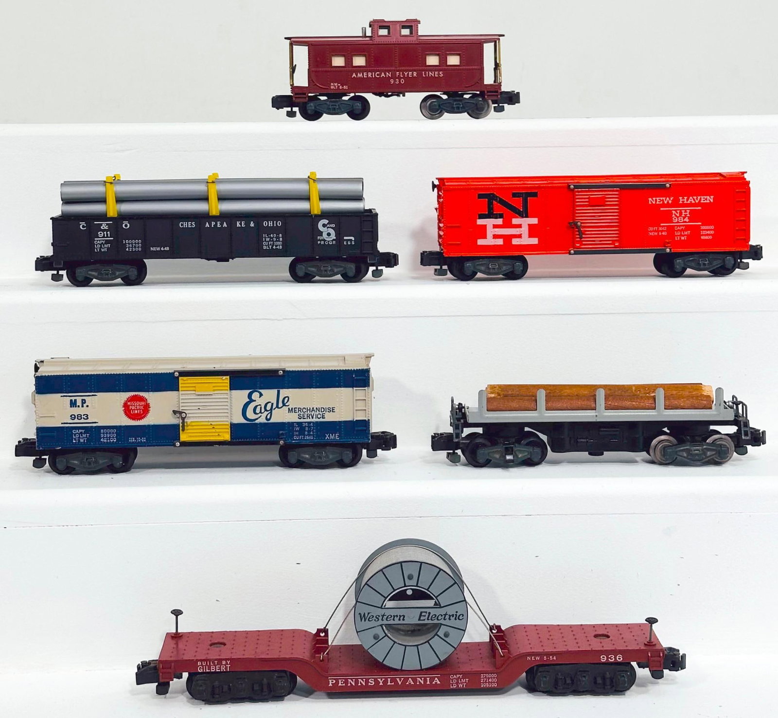 American Flyer Postwar S Gauge Six (6) Assorted Freight Cars: American Flyer Postwar S Gauge Six (6) Assorted Freight Cars, including 914 with log load in C7 to C7 plus, 930 in C7 plus, 911 with silver pipe load in C7 plus, 983 in C7 plus, 984 in C7 plus and 936