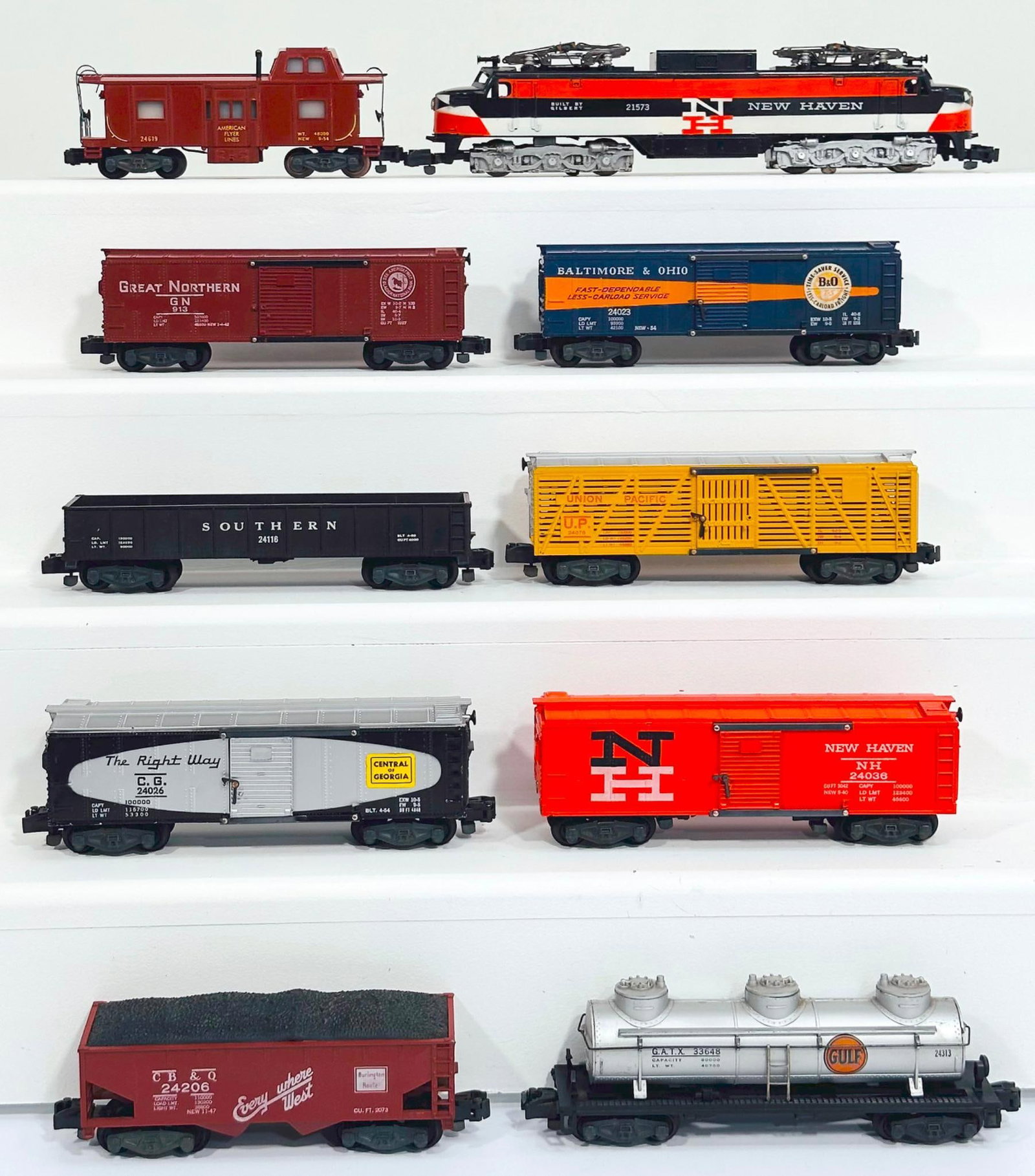 American Flyer Postwar S Gauge 21573 New Haven Electric and Nine (9) Assorted Freight Cars: American Flyer Postwar S Gauge 21573 New Haven Electric and Nine (9) Assorted Freight Cars, with the 21573 in C7 plus, and including 24619 in C7 plus, 24023 in C7 plus, 24076 in C7 plus, 24036 in C7 p
