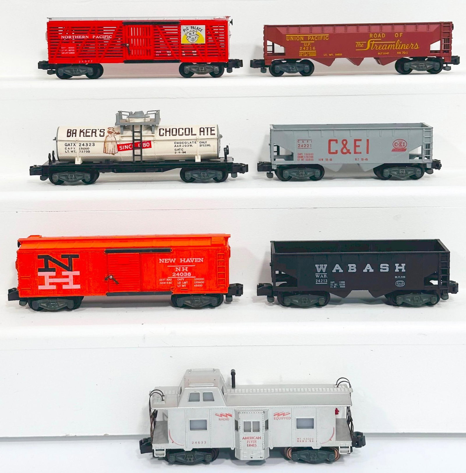 American Flyer Postwar S Gauge Seven (7) Assorted Freight Cars: American Flyer Postwar S Gauge Seven (7) Assorted Freight Cars, including 24213 in C7 plus, 24221 in C7 plus, 24216 in C7 plus, 24036 in C7 plus, 24633 in C7 plus, 24323 Bakerâ€™s Chocolate Ta