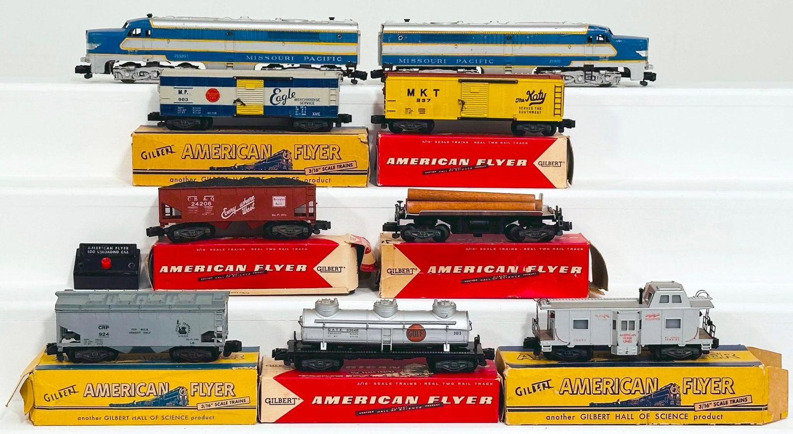 American Flyer Postwar S Gauge 21920 and 21920 - 1 Missouri Pacific A - A Alco Diesel Units and: American Flyer Postwar S Gauge 21920 and 21920 - 1 Missouri Pacific A - A Alco Diesel Units and Seven (7) Assorted Freight Cars, with the 21920 in C6 to C6 plus and missing its horn and the 21920 - 1 