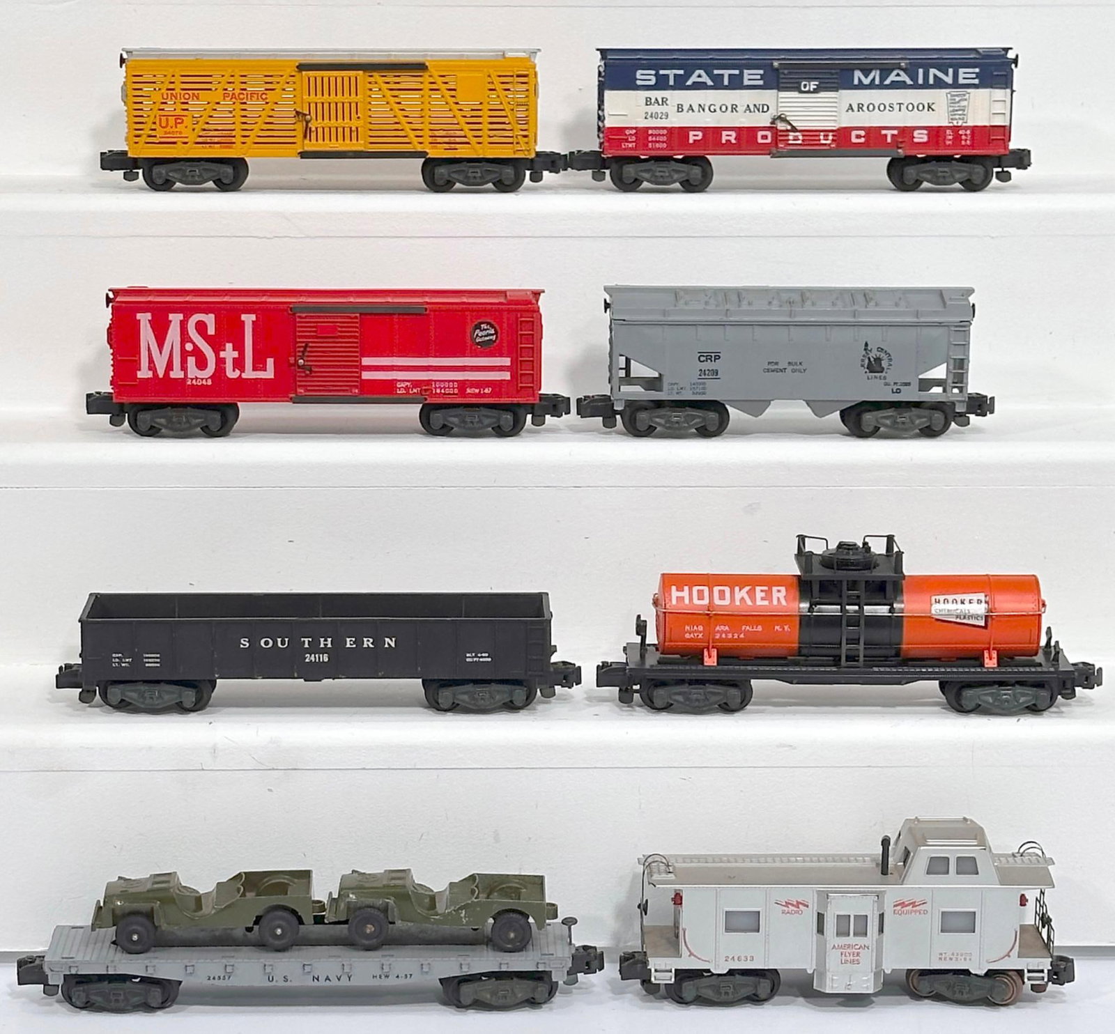 American Flyer Postwar S Gauge Eight (8) Assorted Freight Cars: American Flyer Postwar S Gauge Eight (8) Assorted Freight Cars, including 24048 in C7 plus, 24029 in C7 plus, 24076 in C7 plus, 24029 in C7 plus, 24324 in C7 plus, 24633 in C7, 24557 with 2 Jeep load 
