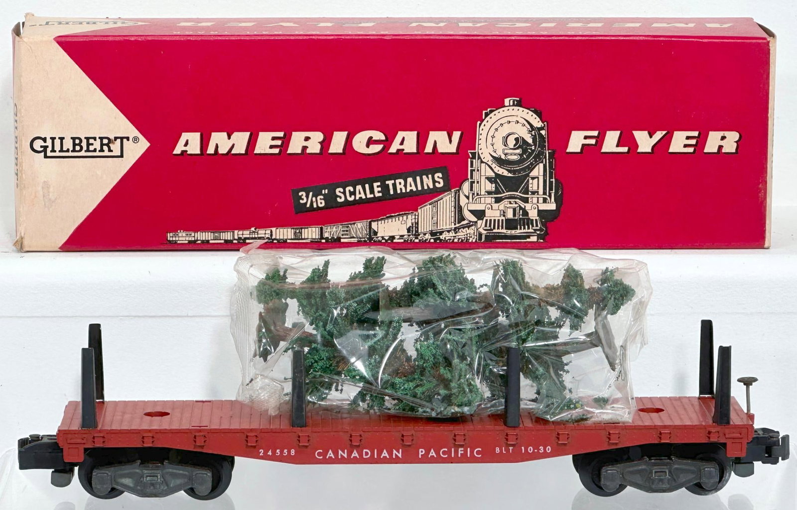 American Flyer Postwar S Gauge 24558 Canadian Pacific Flat Car with original Christmas Trees Boxed: American Flyer Postwar S Gauge 24558 Canadian Pacific Flat Car with original Christmas Trees Boxed, in C7 plus and with its original box.