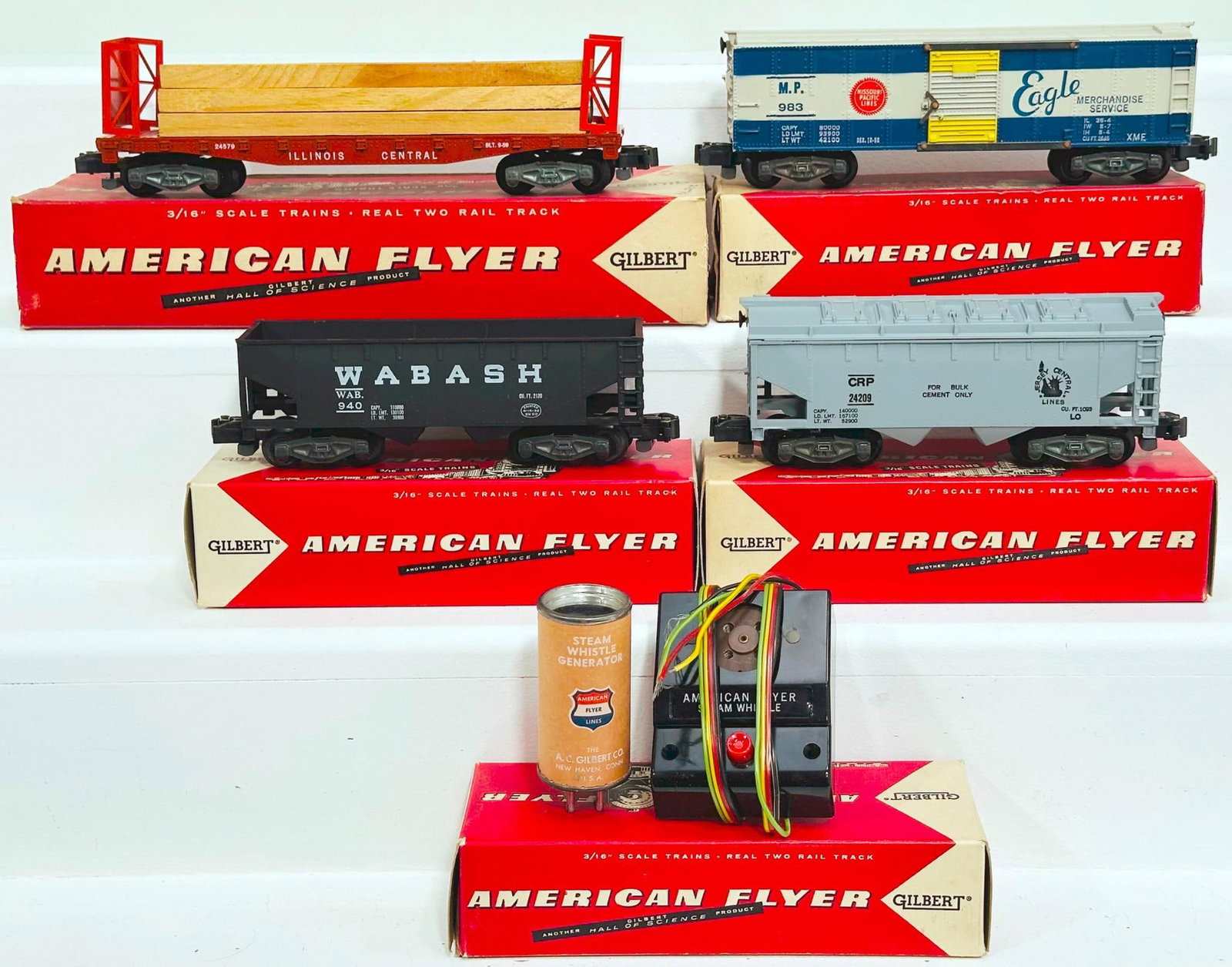 American Flyer Postwar S Gauge Five (5) Assorted Freight Cars Boxed: American Flyer Postwar S Gauge Five (5) Assorted Freight Cars Boxed, including 983, 24209, 940, 24579 with button and 24209, each in C7 plus or better and each with its original box.