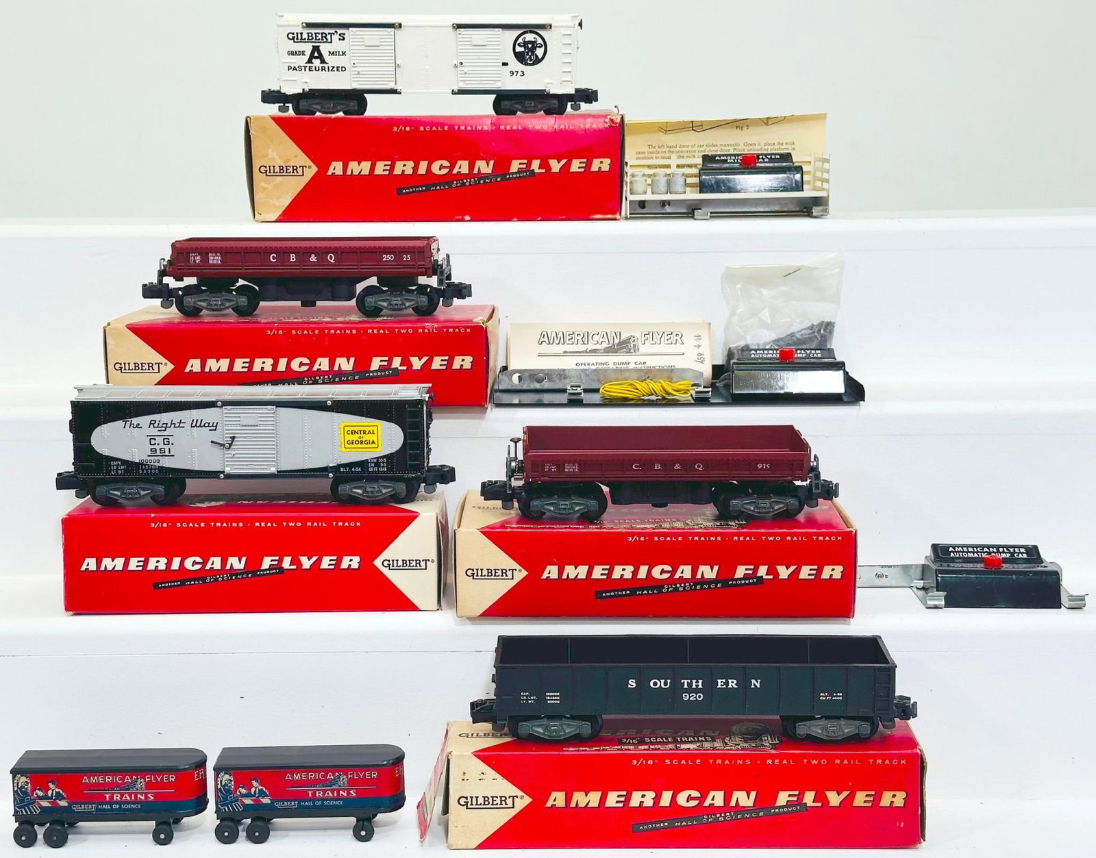 American Flyer Postwar S Gauge 25008 Operating Dump Car, 973 Operating Milk Car, 920 Gondola, 981: American Flyer Postwar S Gauge 25008 Operating Dump Car, 973 Operating Milk Car, 920 Gondola, 981 Box Car and 25025 Operating Dump Car, each in C7 plus and each with its original box.