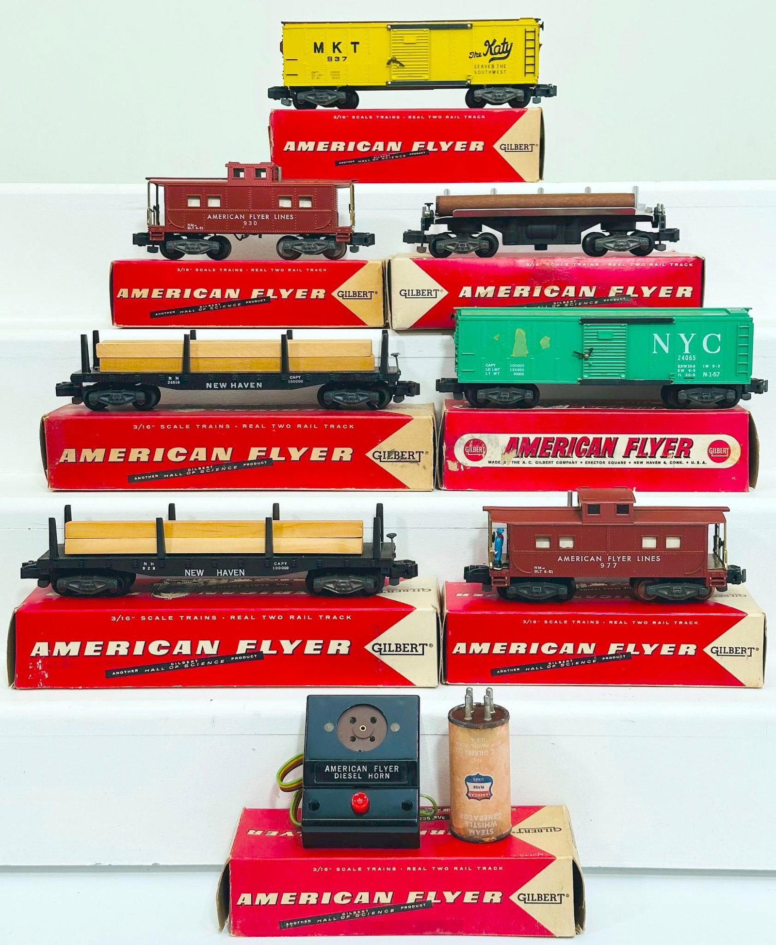 American Flyer Postwar S Gauge Seven (7) Assorted Freight Cars and Diesel Horn: American Flyer Postwar S Gauge Seven (7) Assorted Freight Cars and Diesel Horn, including 24065 in C7 and with its original box, 937 in C7 and with its original box, 928 in C7 plus and with its origin