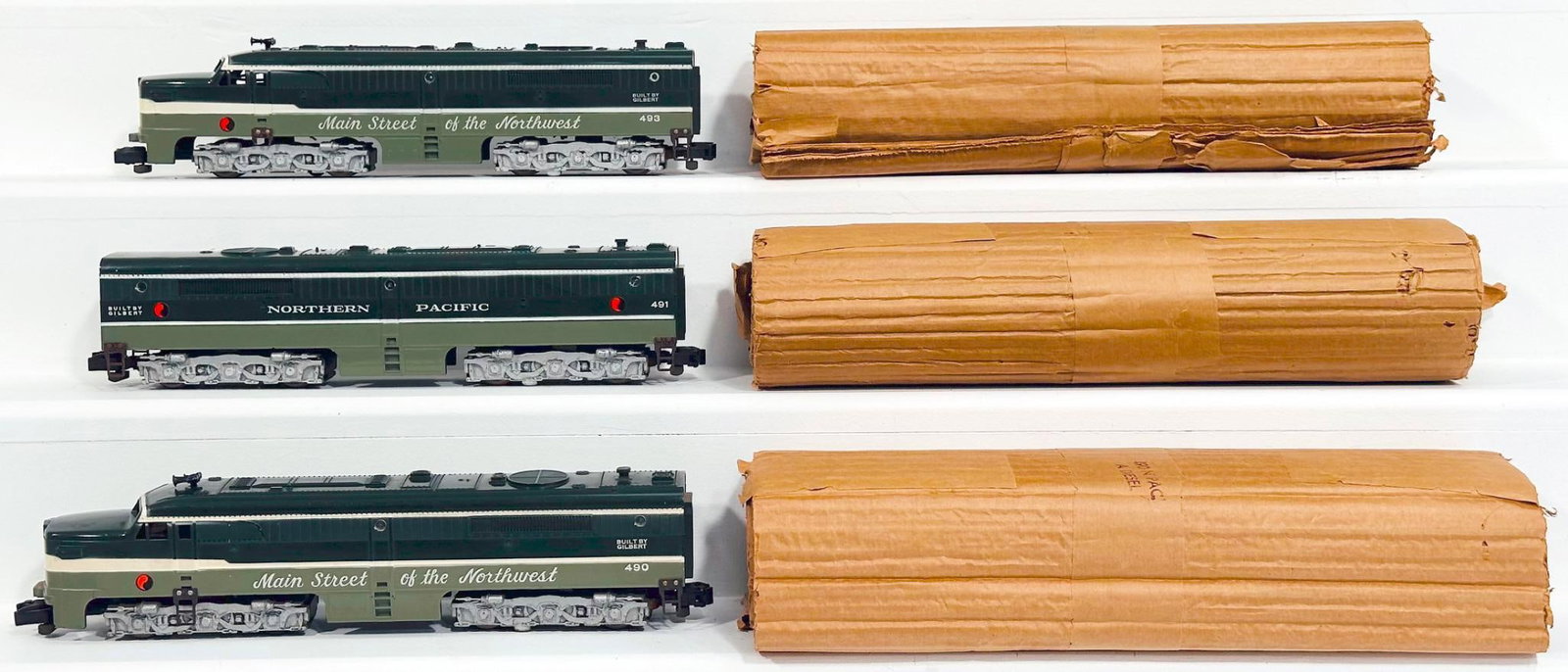 American Flyer Postwar S Gauge 490 - 491 - 493 Northern Pacific A - B - A Alco Diesel Units: American Flyer Postwar S Gauge 490 - 491 - 493 Northern Pacific A - B - A Alco Diesel Units, each in C7 or better and each with its original wrap.