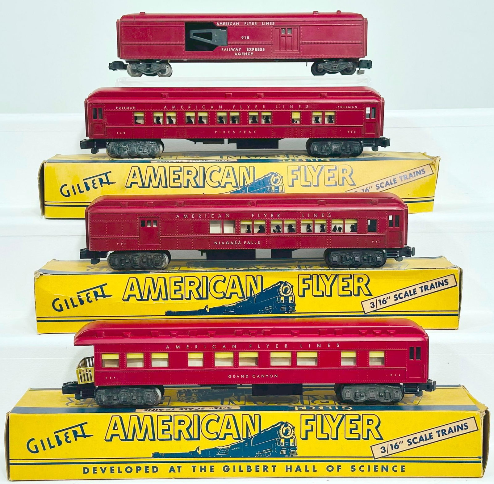 American Flyer Postwar S Gauge 953 - 952 - 954 - 918 dark red plastic Passenger Cars: American Flyer Postwar S Gauge 953 - 952 - 954 - 918 dark red plastic Passenger Cars, each in C7 plus or better, with the 952 and 953 having silhouettes in the window. Includes original boxes for the 