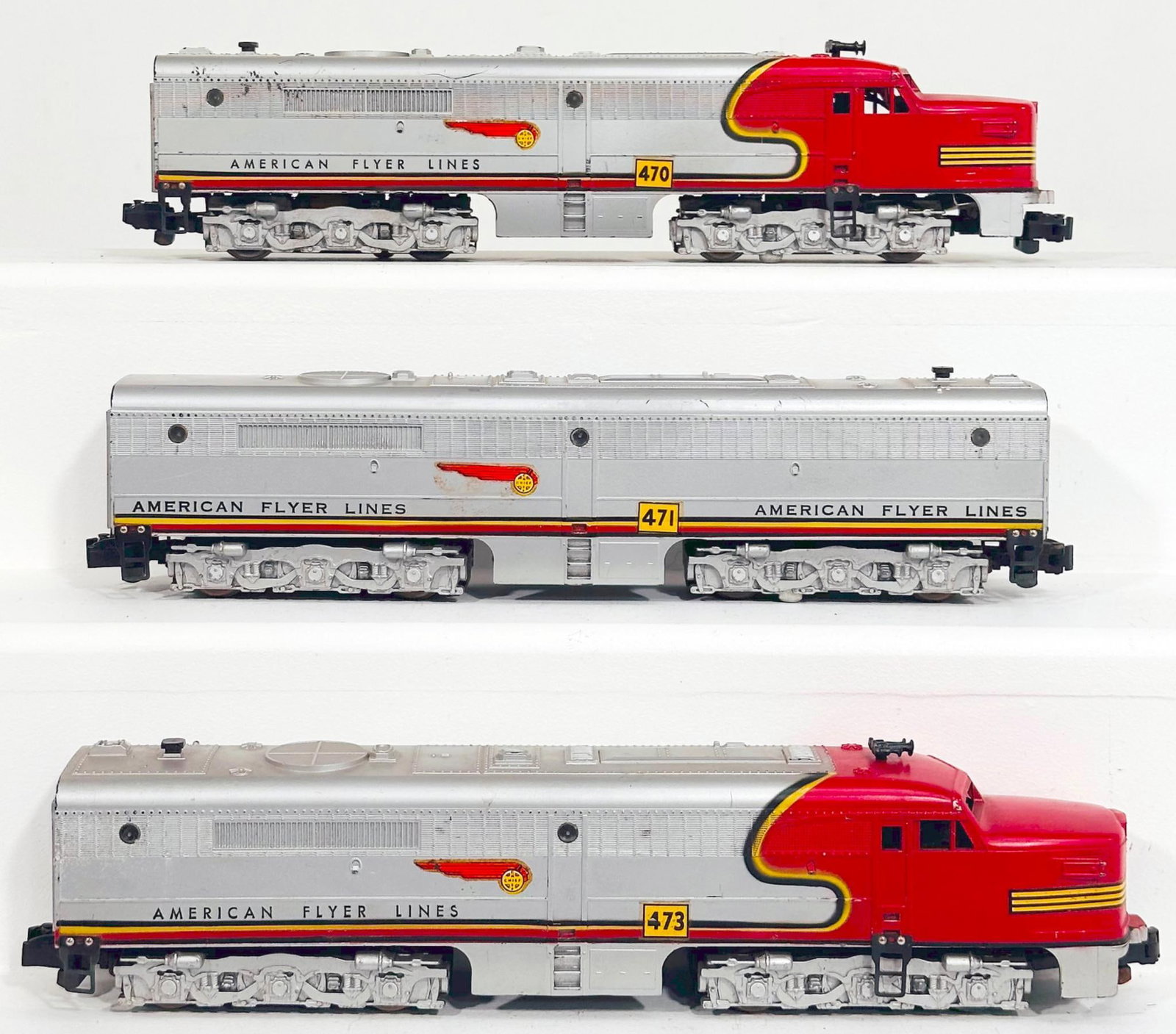 American Flyer Postwar S Gauge 470 - 471 - 473 Santa Fe red and silver A - B - A Alco Diesel Units: American Flyer Postwar S Gauge 470 - 471 - 473 Santa Fe red and silver A - B - A Alco Diesel Units, with the 470 in C7 minus, the 471 in C7 or better and the 473 in C7 or better.