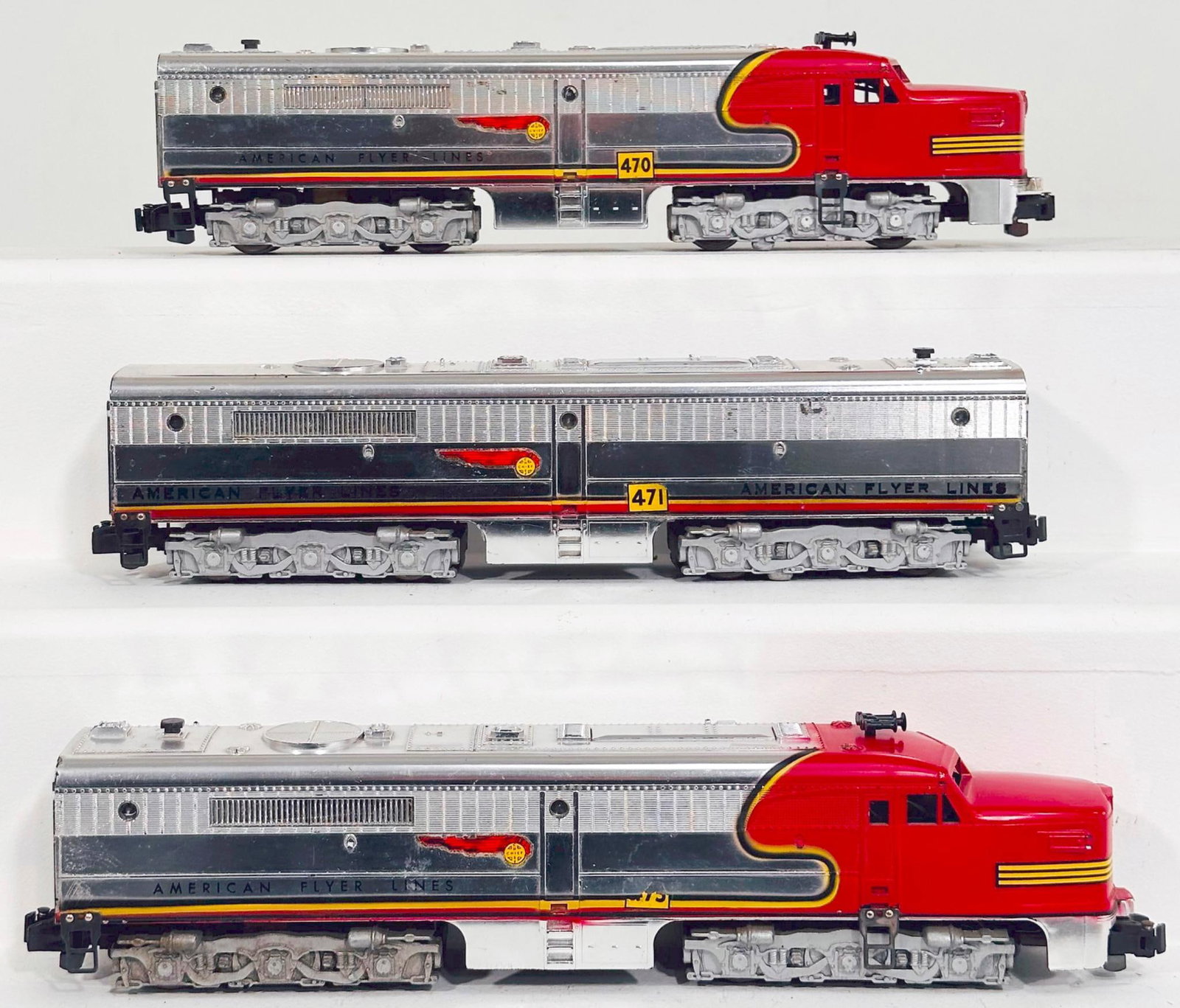 American Flyer Postwar S Gauge 470 - 471 - 473 Santa Fe Chrome and red A - B - A Alco Diesel Units: American Flyer Postwar S Gauge 470 - 471 - 473 Santa Fe Chrome and red A - B - A Alco Diesel Units, with the 470 in C7, 471 in C7 to C7 plus and 473 in C7 because of decal loss on one side and red pin