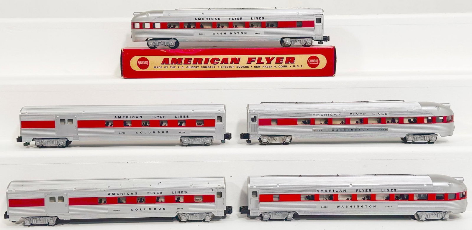 American Flyer on Postwar S Gauge Five (5) Assorted Aluminum Passenger Cars with red stripes through: American Flyer on Postwar S Gauge Five (5) Assorted Aluminum Passenger Cars with red stripes through window, including 24773, 24773, 2963, 24833 and 24833, each in C7 to C7 plus. This Lot also include