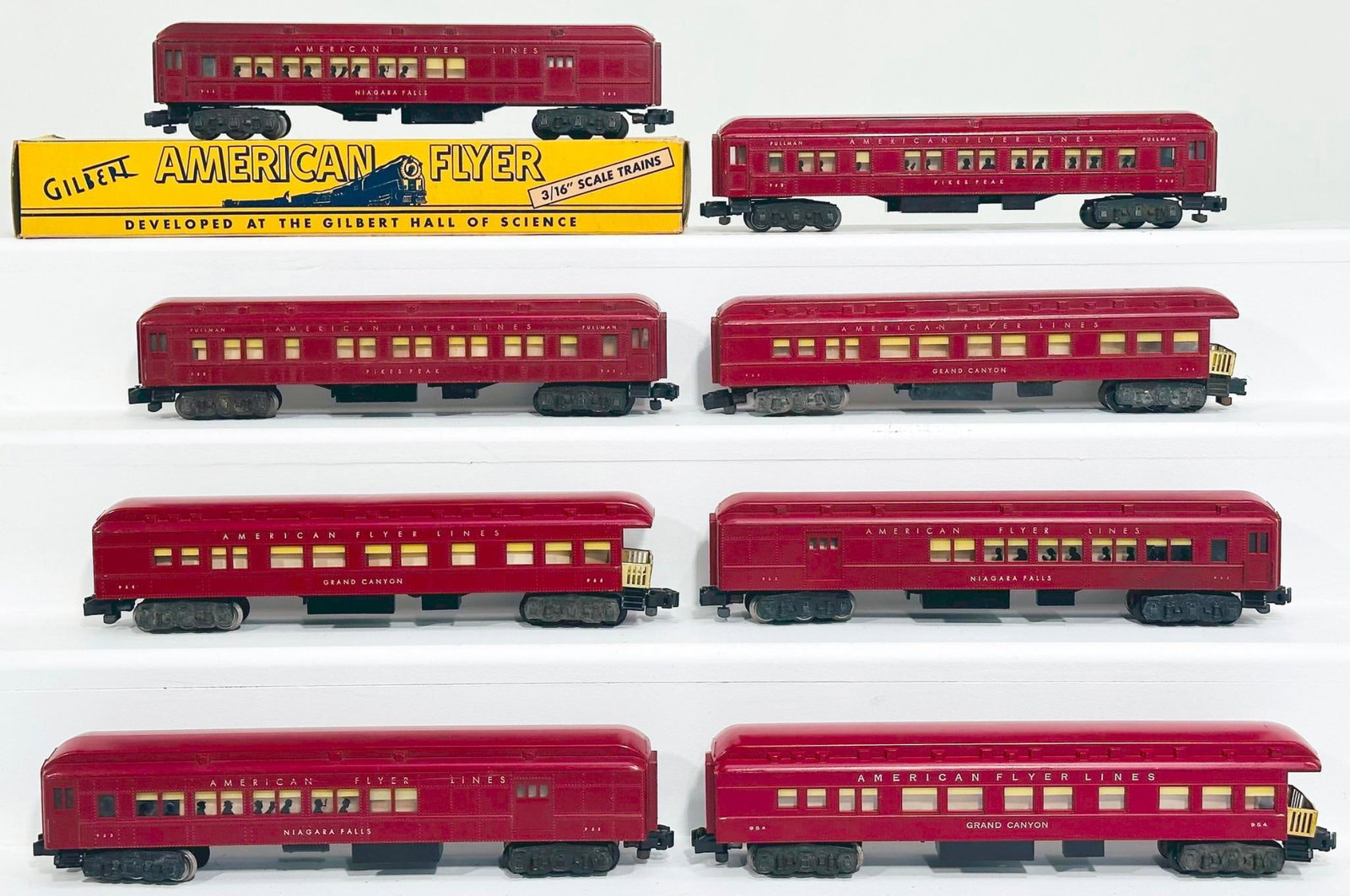 American Flyer Postwar S Gauge Eight (8) Assorted dark red plastic Passenger Cars: American Flyer Postwar S Gauge Eight (8) Assorted dark red plastic Passenger Cars, including 162 in C7 with silhouettes in window, 954 in C6 because of corrosion on the underside, 953 in C7 plus with 