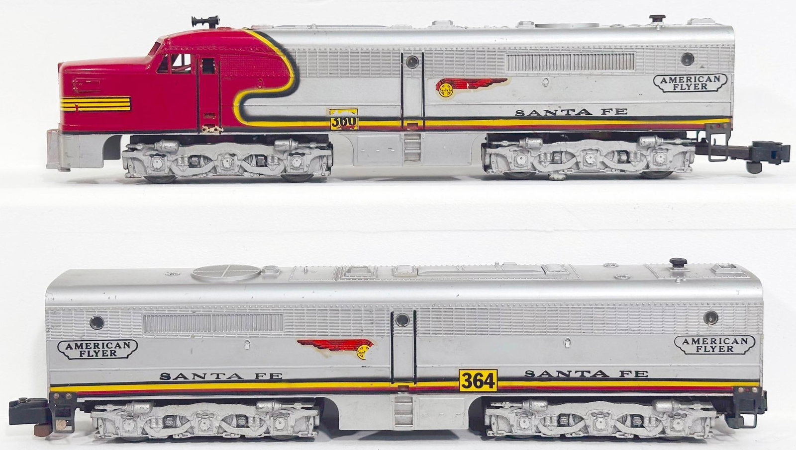 American Flyer Postwar S Gauge 360 and 364 Santa Fe red and silver A - B Alco Diesel Units: American Flyer Postwar S Gauge 360 and 364 Santa Fe red and silver A - B Alco Diesel Units, with the 360 in C7 or better and the 364 in C7 minus because of decal loss on one side.