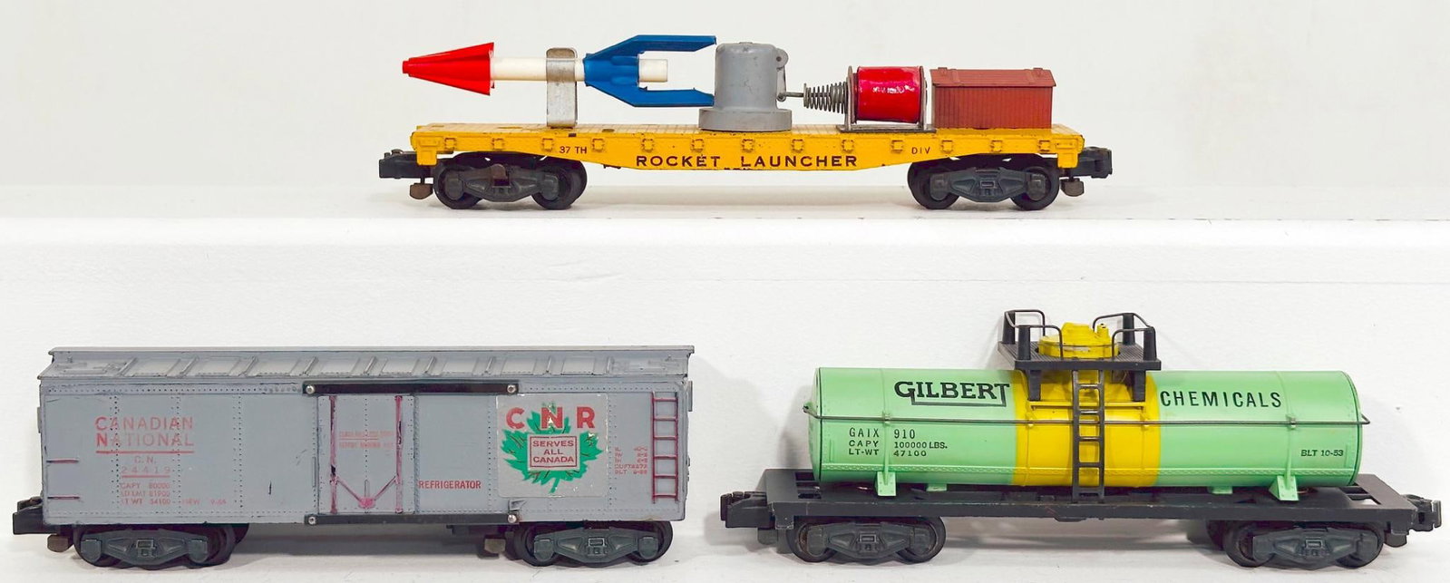 American Flyer Postwar S Gauge 25046 Rocket Launcher Car - Canadian National 24419 Reefer - 910: American Flyer Postwar S Gauge 25046 Rocket Launcher Car - Canadian National 24419 Reefer - 910 Gilbert Tank Car, each in C7 or better.