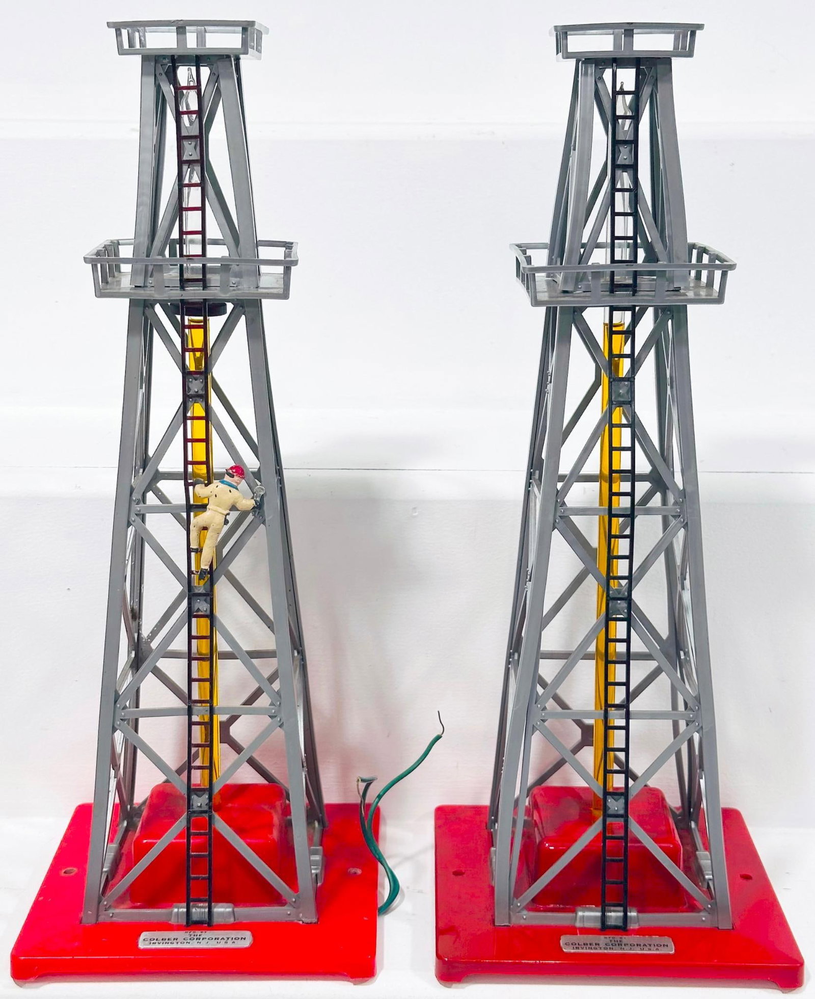 Colber Postwar S Gauge Oil Derrick X2 - with RARE climbing man: Colber Postwar S Gauge Oil Derrick X2 - with RARE climbing man, each in C7 and one with the RARE man climbing the ladder.