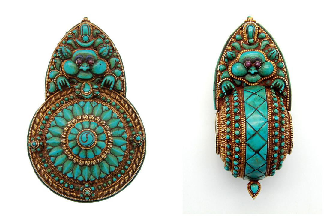 A Tibetan Set of Two Mooneaters: A Set of Two Mooneaters Central Tibet, Lhasa Utsang, circa 20th century Silver with Gold Gilt Turquoise with Ruby Eyes The larger one is 12 cm x 7.8 cm; the smaller is 10 cm x 4 cm A set of male gover