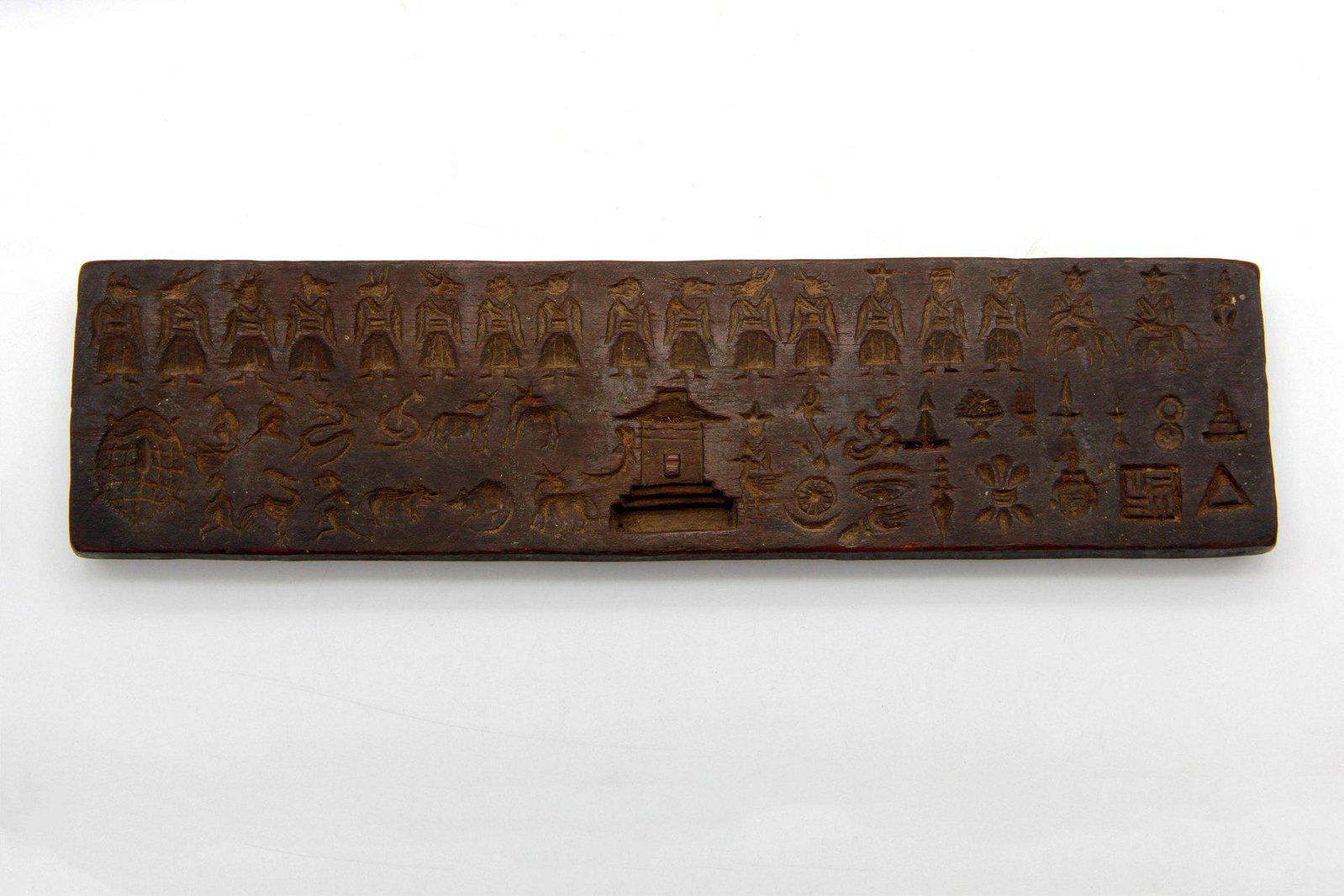 Antique Tibetan Bon Manuscript Print Block: A Manuscript Wood Print Block Tibet, circa late 18th century 32 cm x 8 cm From Bon religious figures for Bon practice for healing ourselves and others.
