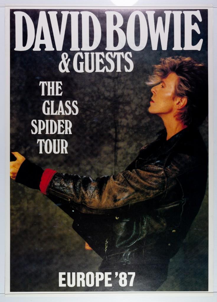 1987 David Bowie Glass Spider Tour: This large merchandising poster exhibits a cool design used for the David Bowie Glass Spider 1987 tour. --CRITICAL DETAILS-- --TITLE: David Bowie Glass Spider Tour --GRADE: