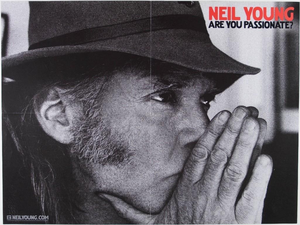 2002 Neil Young Are You Passionate? Promotional Poster Extra Fine 69: This promotional poster was distributed by Reprise Records for Neil Young's 2002 album Are You Passionate? Condition Details: Reprise Records. Folded into 1/4s, top edge tear --CRITICAL DETAI