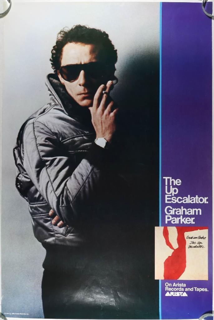 1980 Arista Records Graham Parker The Up Escalator Promotional Poster Excellent 77: This promotional poster was distributed by Arista Records for Graham Parker's 1980 studio album, The Up Escalator. Condition Details: Arista Records promo --CRITICAL DETAILS-- --TITLE Graham