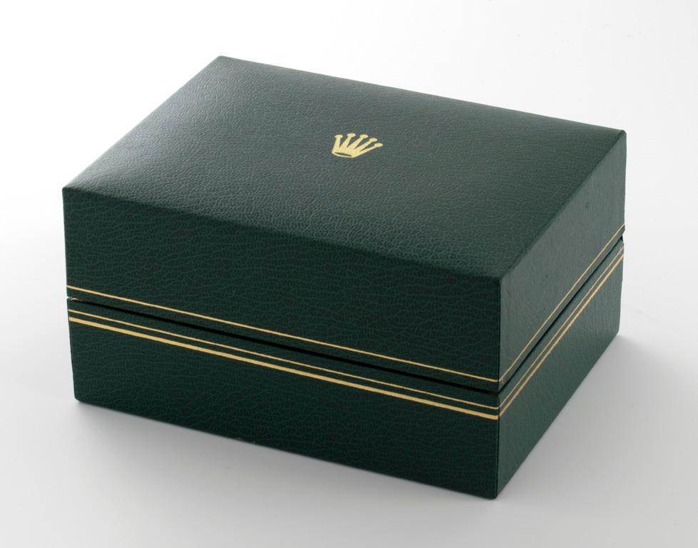 Rolex Oyster Perpetual Gentleman's Wrist Watch: Having a blue face with gilt roman numerals, face marked Rolex Oyster Perpetual, Date/Adjust, superlative chronometer/official certified, two toned 18k yellow gold and stainless Jubilee band marked 45