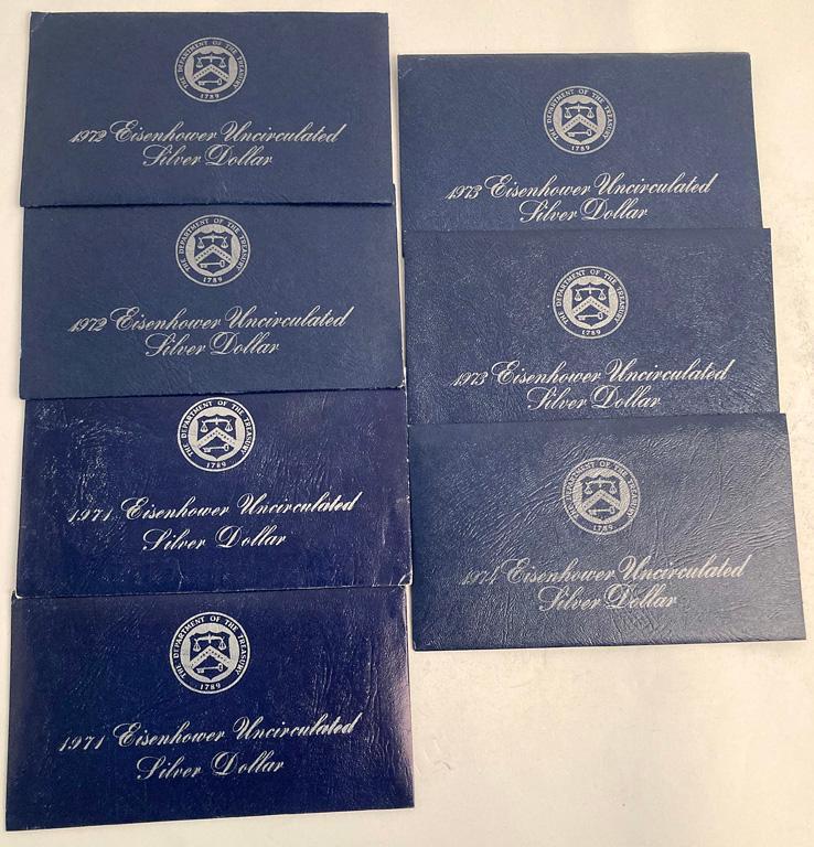 Group of United States Eisenhower Liberty Dollars: A group of United States Eisenhower Liberty dollar coins, 2 1971, 2 1972, 2 1973, and 1 1974. Each in original plastic with paperwork and envelope. Overall good condition.
