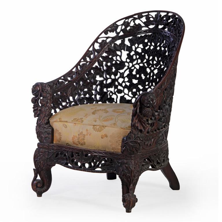 An Elaborately Carved Burmese Gondola Chair (1 of 2)