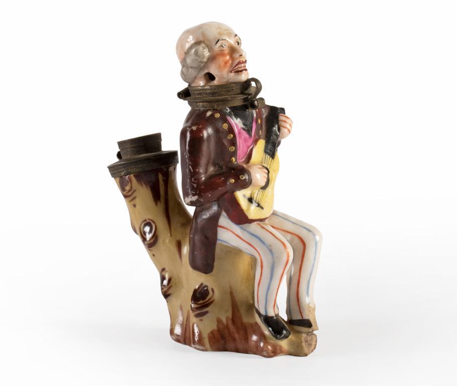 A Paint Decorated Porcelain Figural Pipe of Gentleman with Instrument (1 of 4)