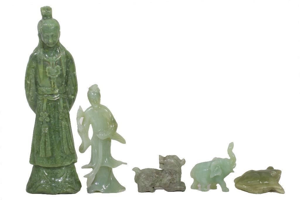 A Grouping of Various Jadeite Figures and Animals: China, 20th century. Five pieces in jadeite of Guanyin, one larger figure, an elephant, a frog, and foo dog. Largest figurine measures 12.0" H x 3.5" W.